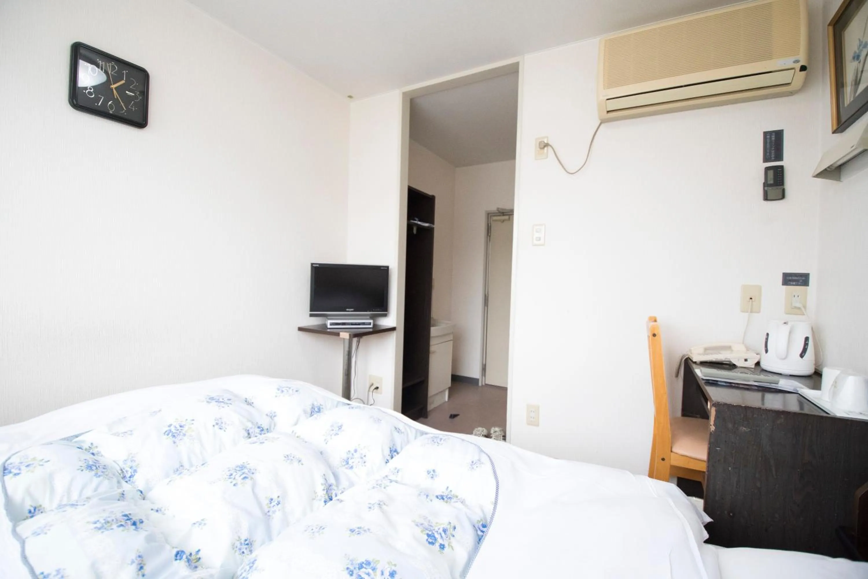 Bed in Hikone Station Hotel