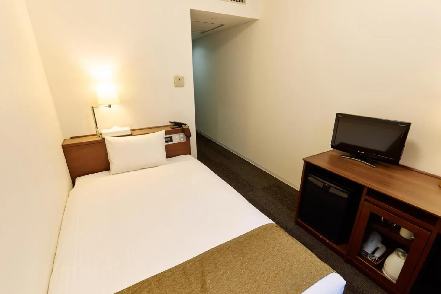 Bed in Ginza International Hotel