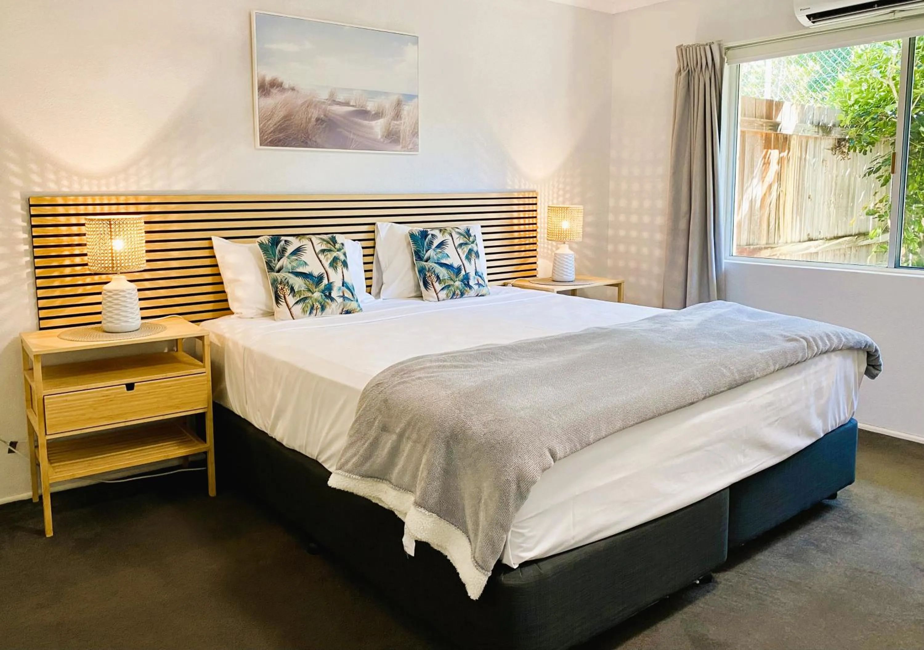 Bed in Lychee Tree Holiday Apartments