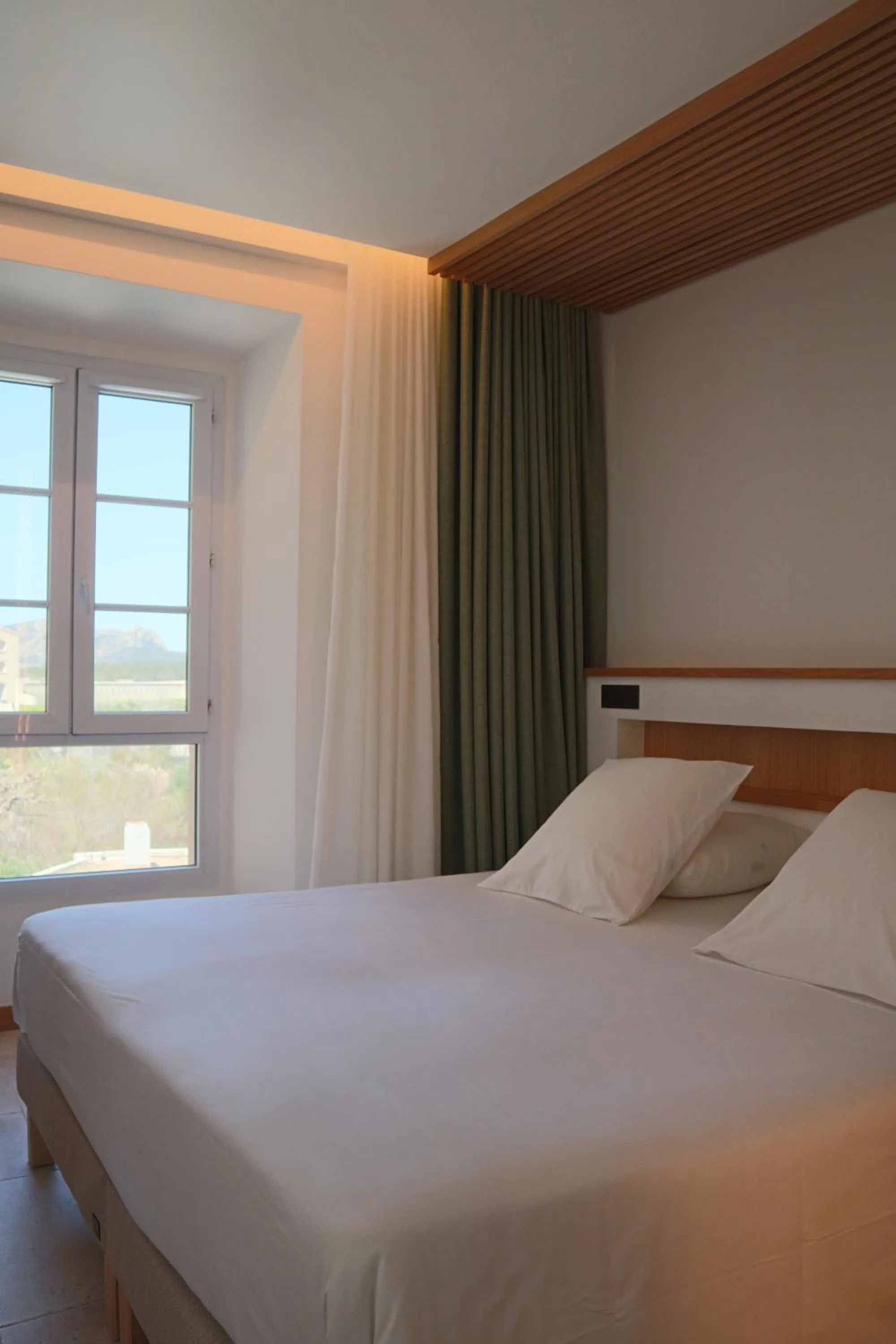 Bed in Le Royal Hôtel Restaurant