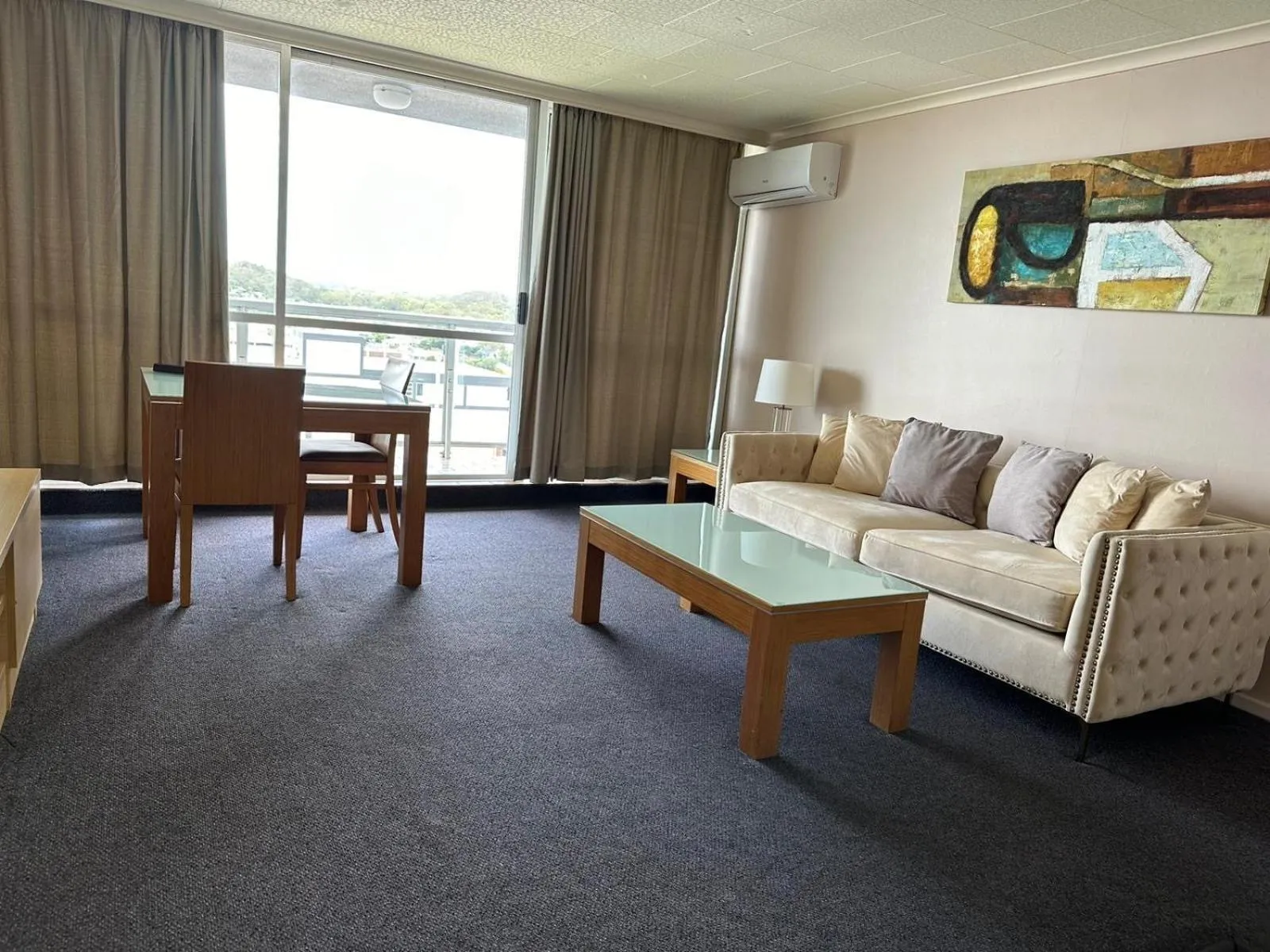 Living room in Highpoint International Hotel