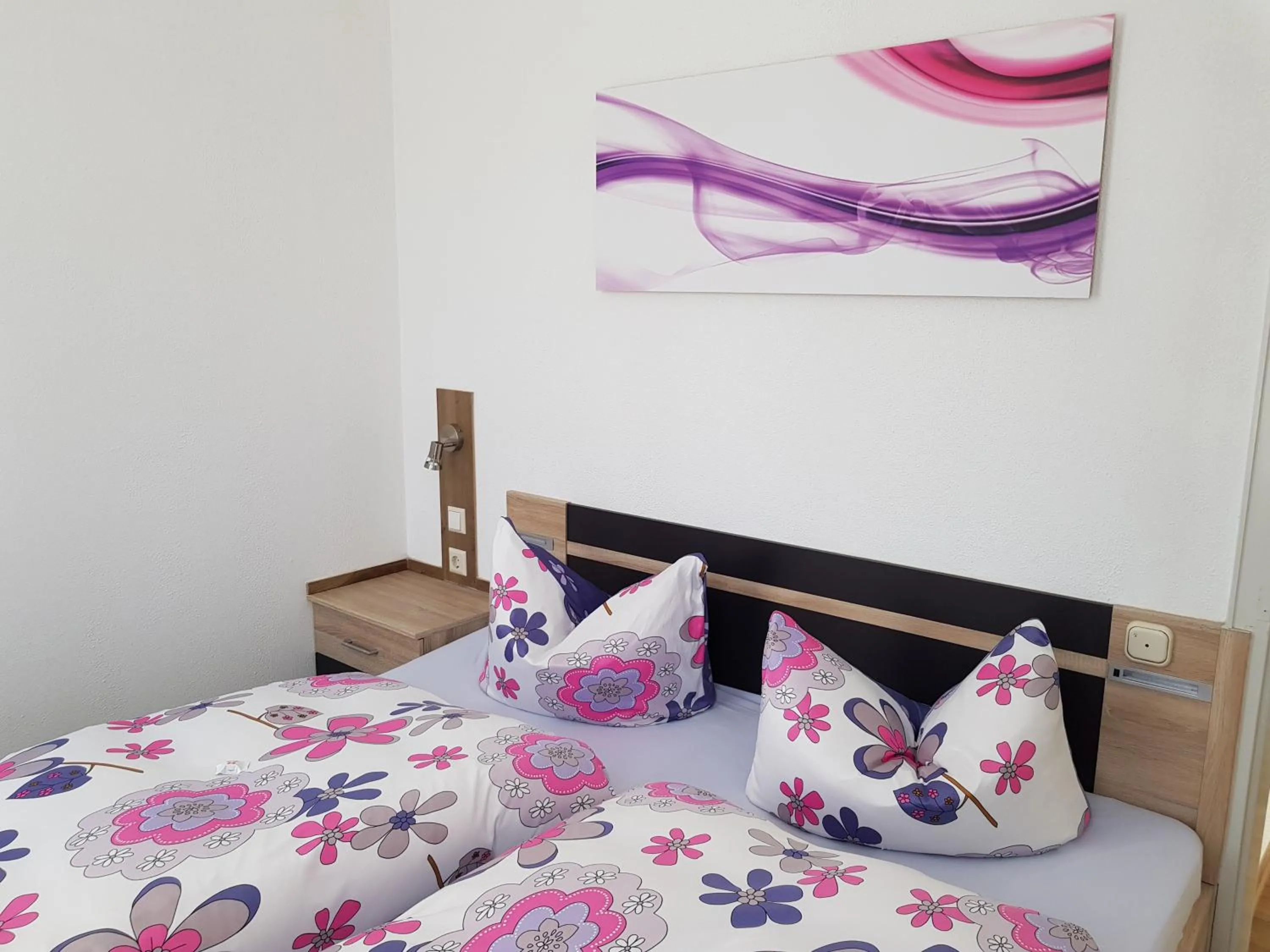 Bed in Macke`s Ferienwohnungen