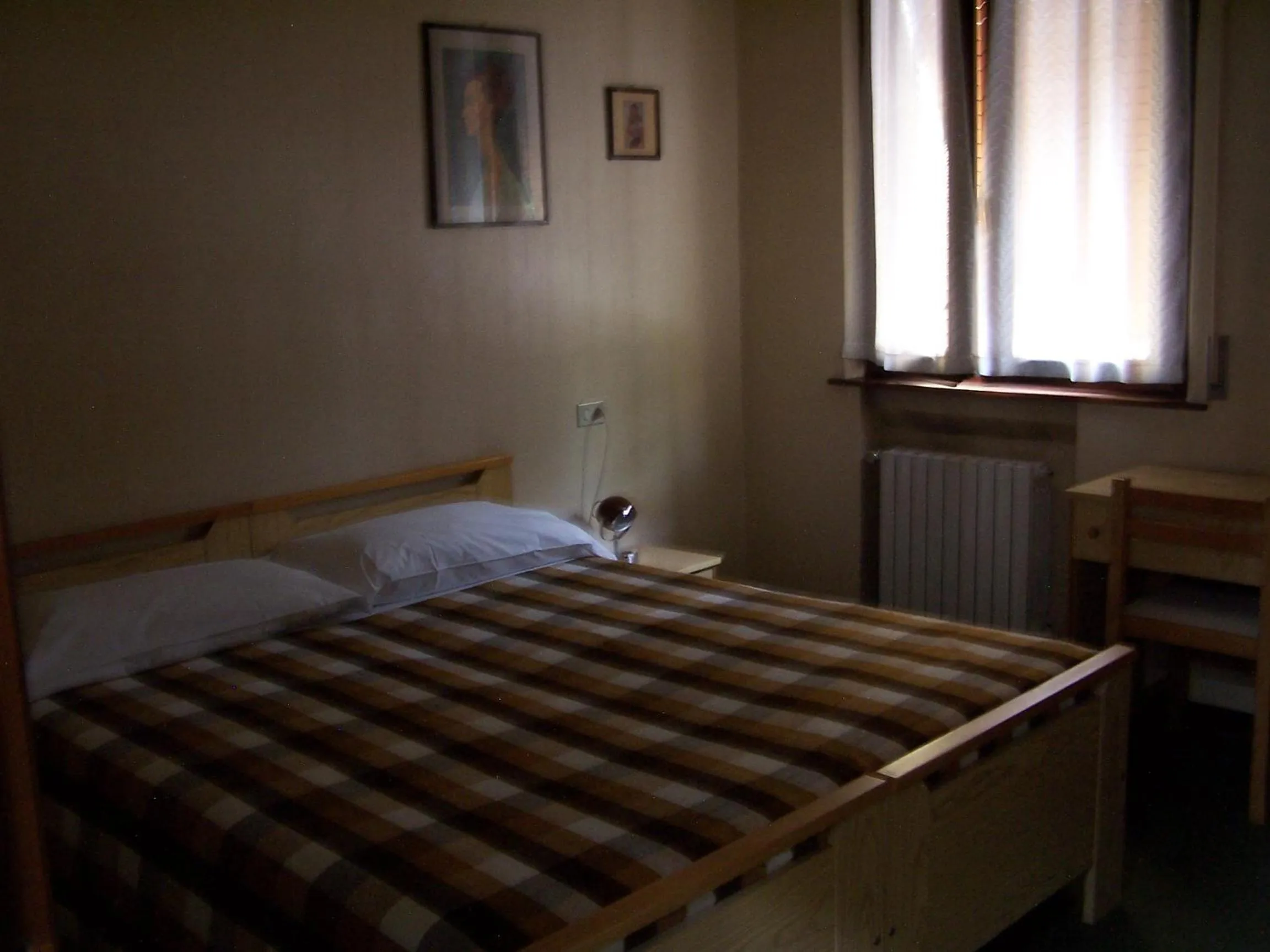 Bed in Albergo Corona