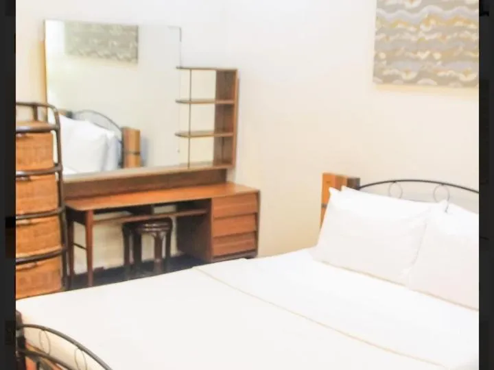 Bed in Balay 8 Suites