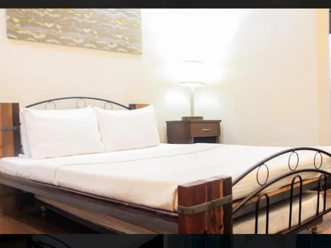 Bed in Balay 8 Suites