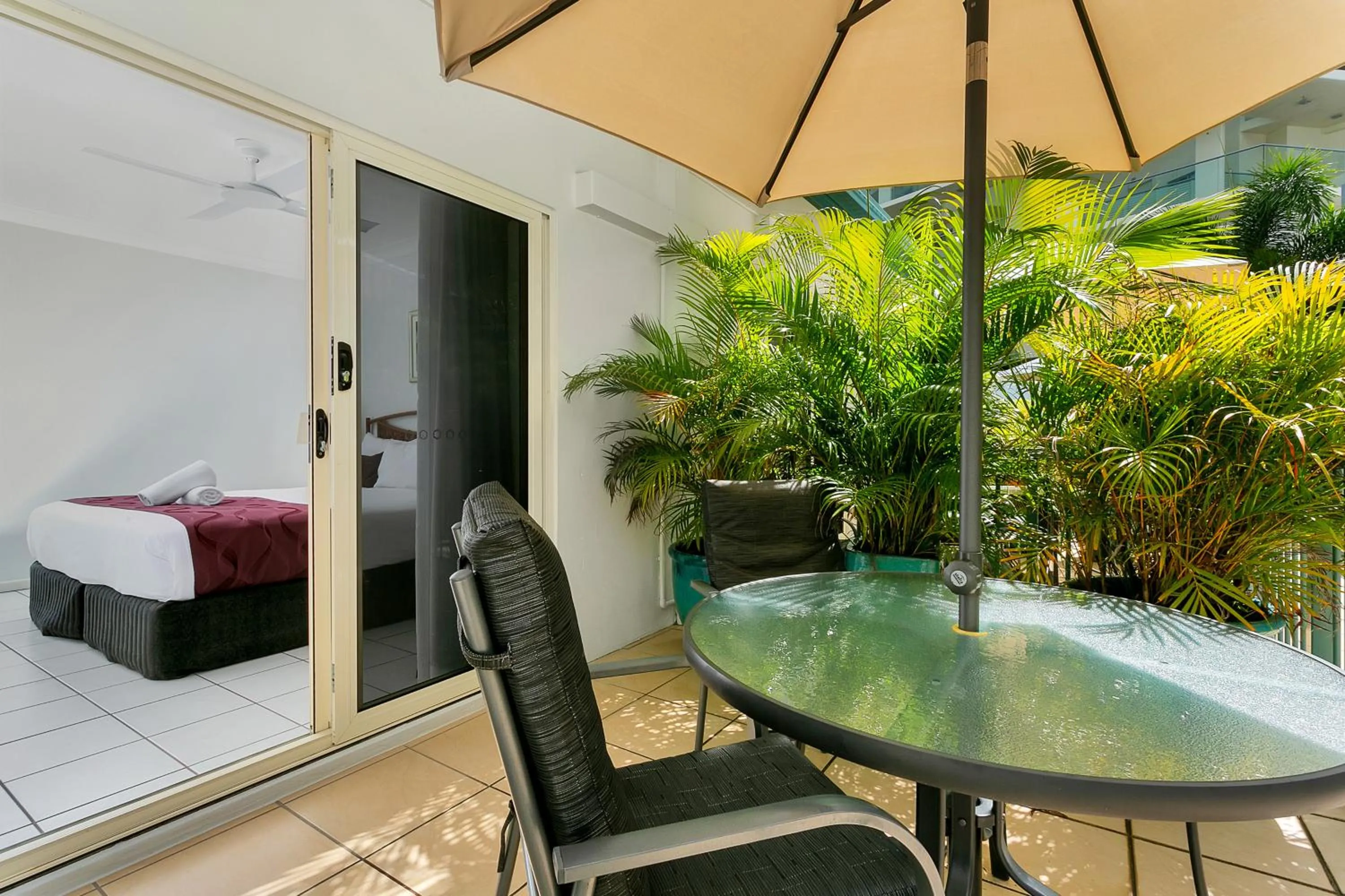 Patio, Bed in Beachfront Apartments on Trinity Beach