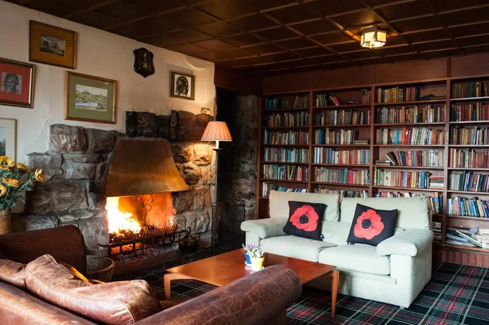 Communal lounge/ TV room in Loch Ness Lodge Hotel