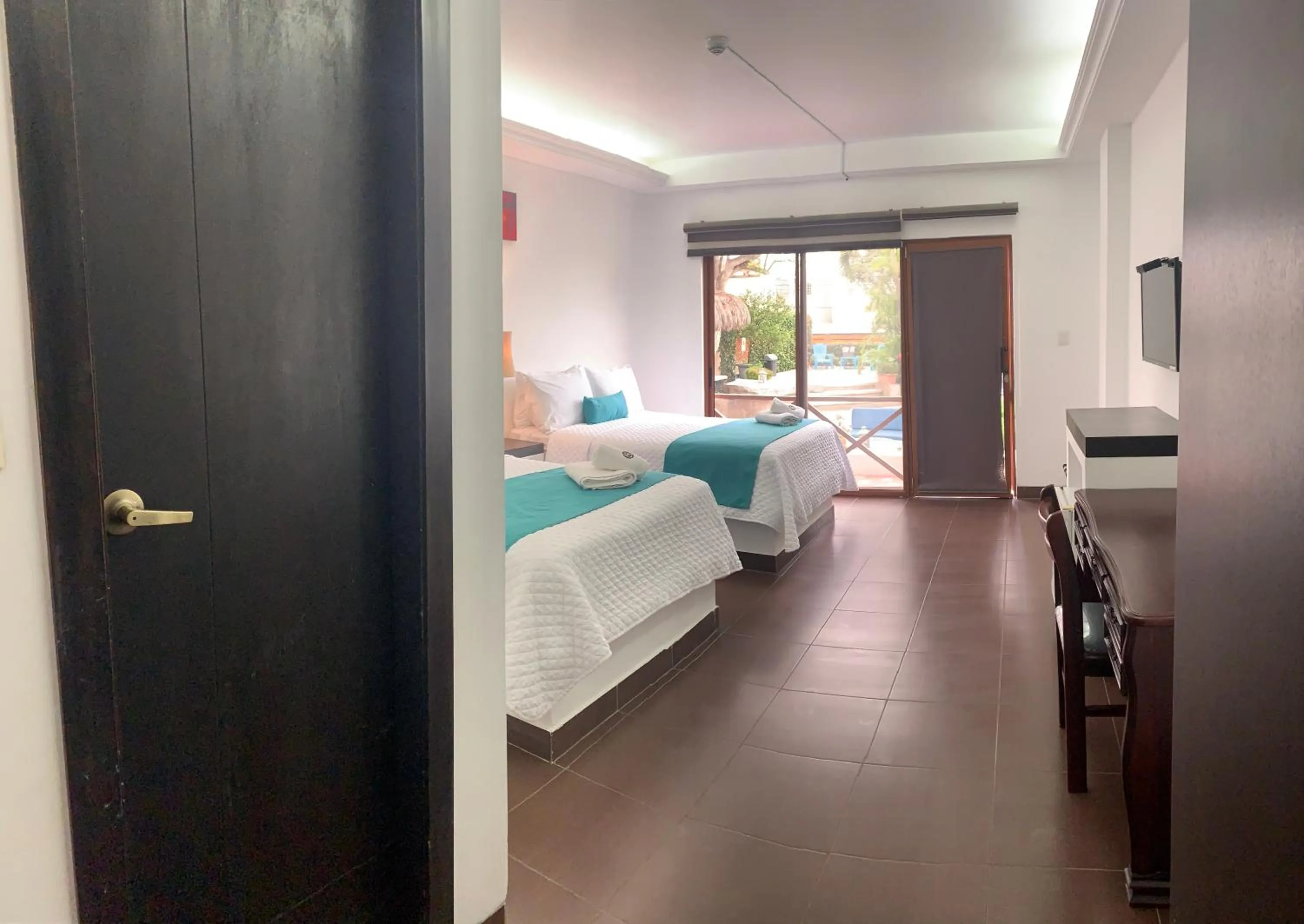 Photo of the whole room, Bed in Hosteria Punta Blanca