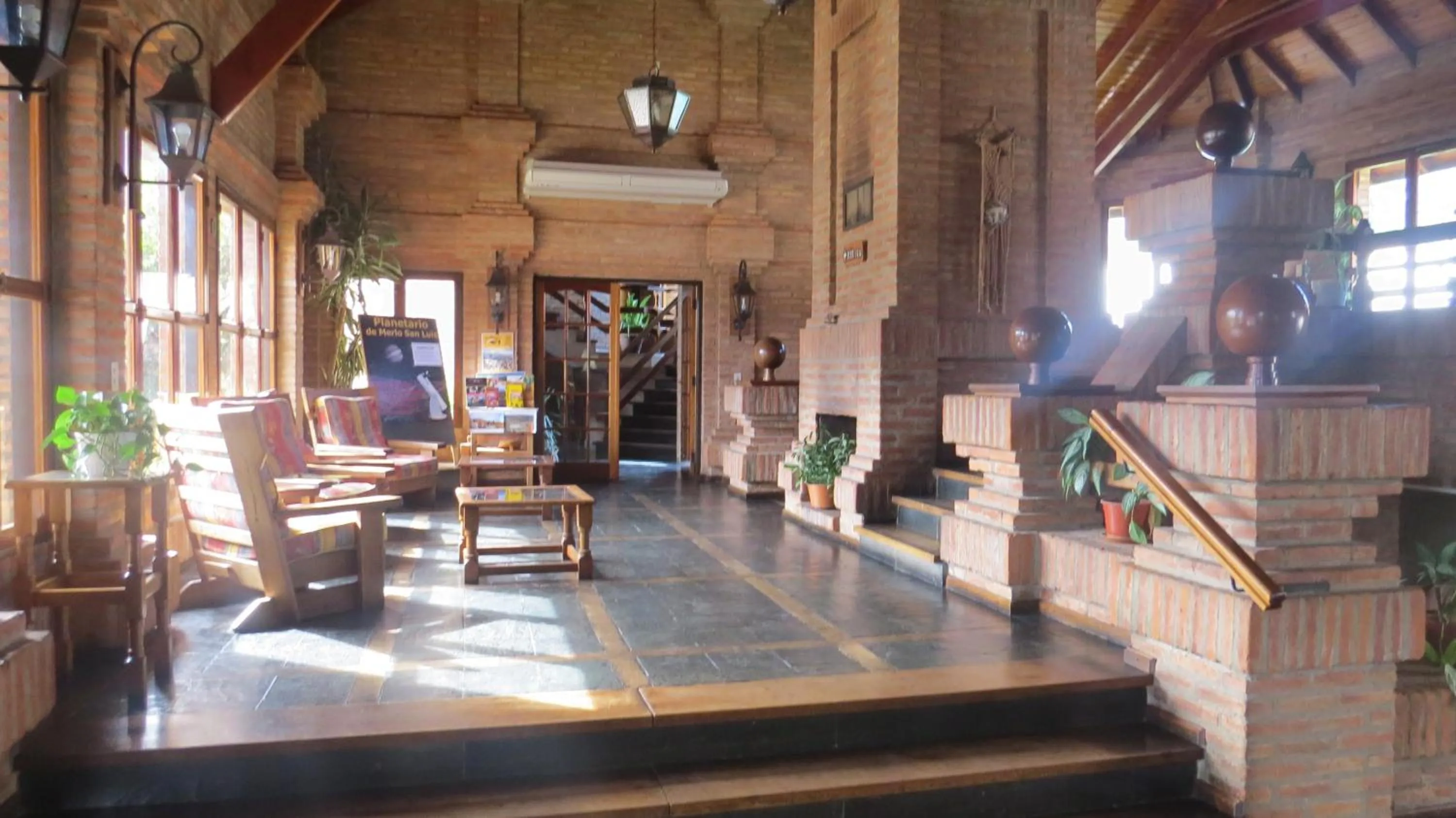 Communal lounge/ TV room in Villa de Merlo All Inclusive & Spa by MH