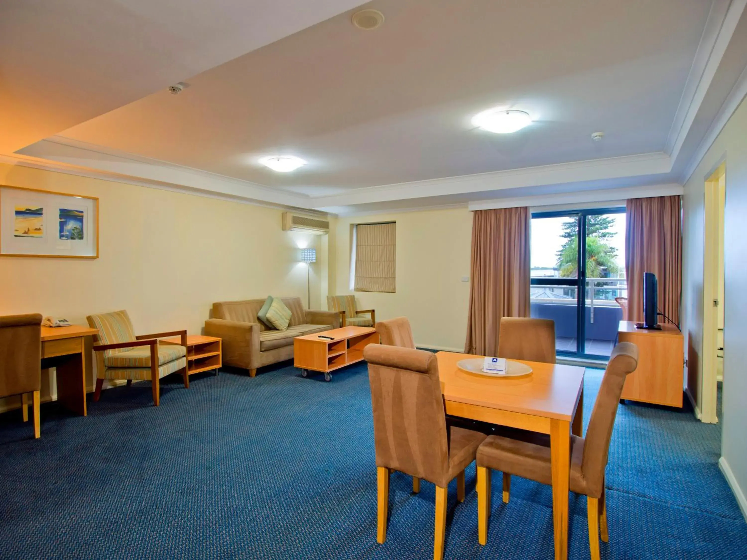 Living room in Oaks The Entrance Waterfront Suites Living room in Oaks The Entrance Waterfront Suites