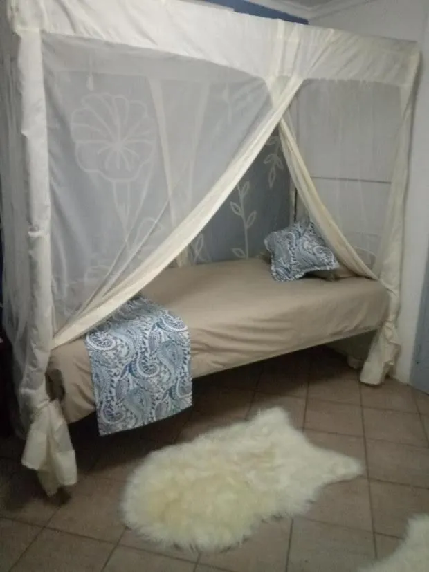 Bed in Fawlty Towers Accommodation & Activities