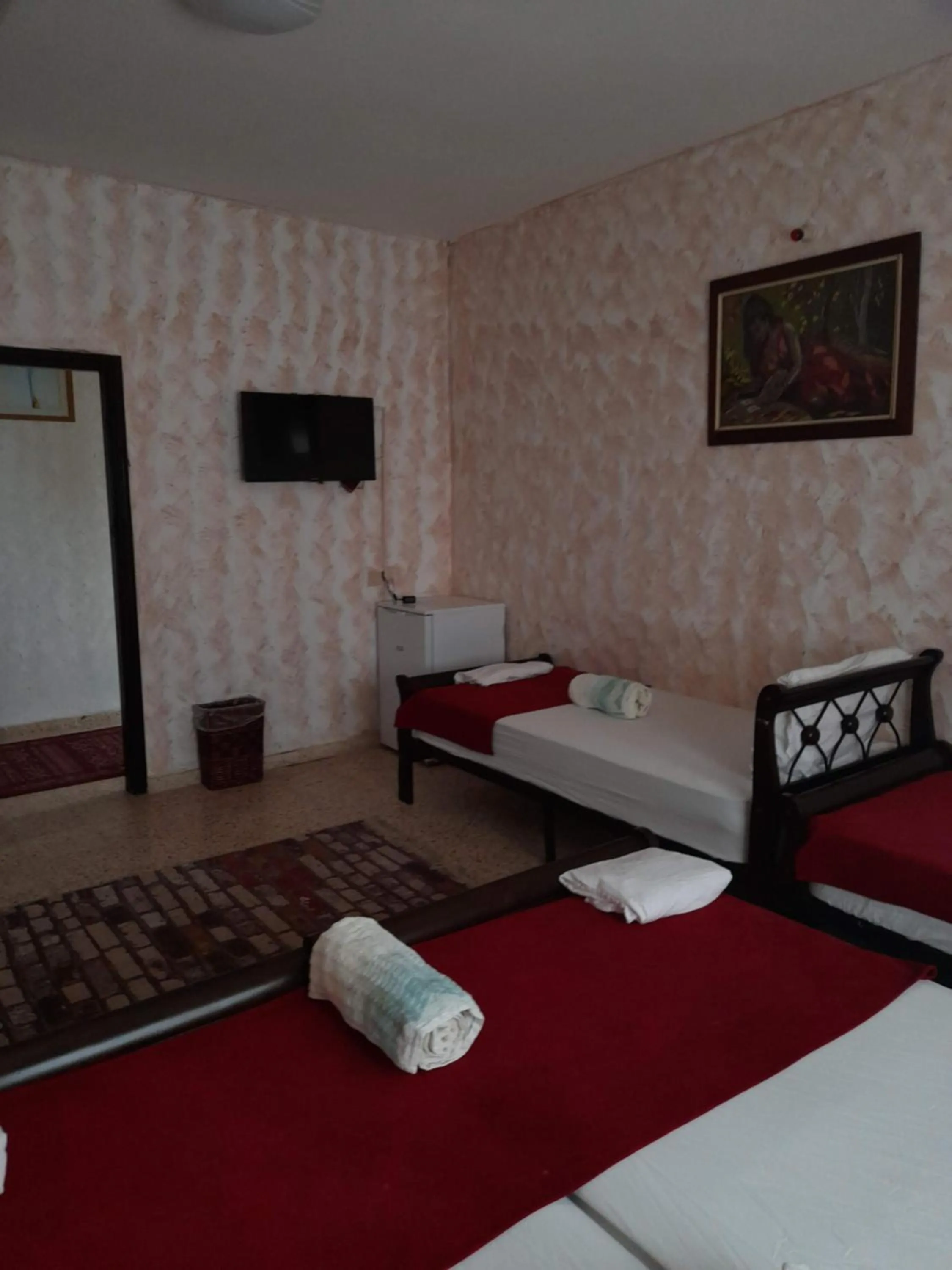 Photo of the whole room, Bed in Magtas Hotel