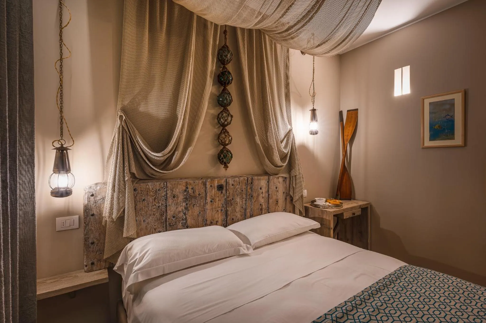 Bed in A'Mare Luxury Rooms