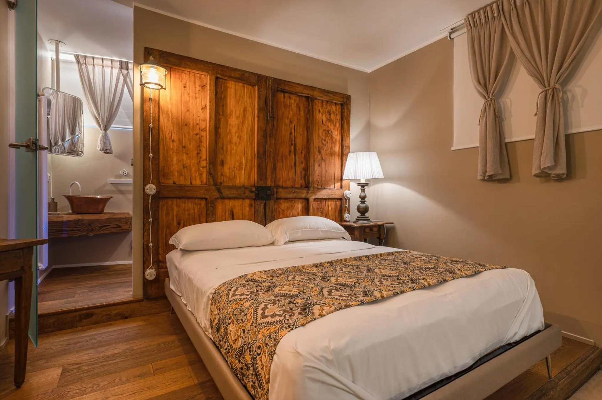 Bed in A'Mare Luxury Rooms