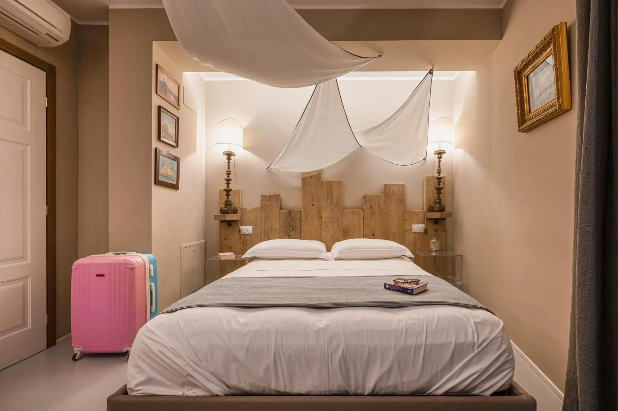 Bed in A'Mare Luxury Rooms