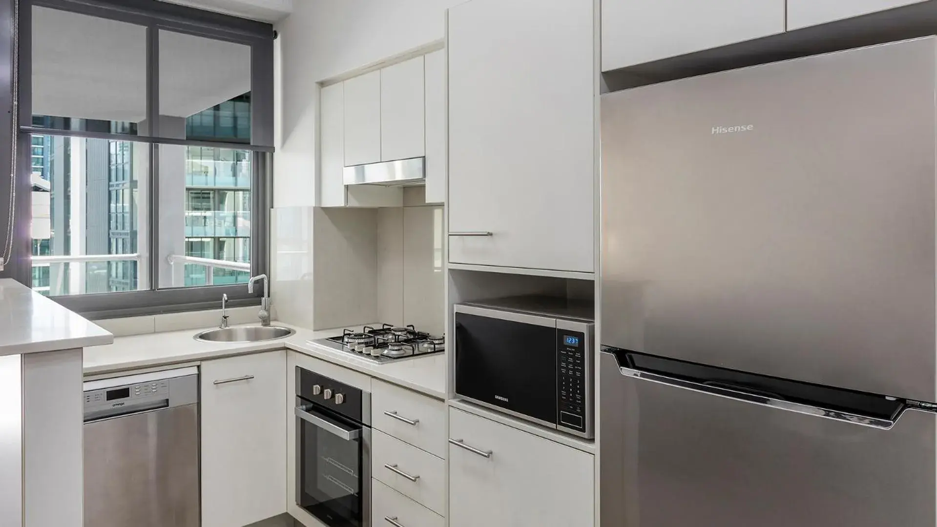 Kitchen or kitchenette in Oaks Brisbane on Margaret Suites Kitchen or kitchenette in Oaks Brisbane on Margaret Suites
