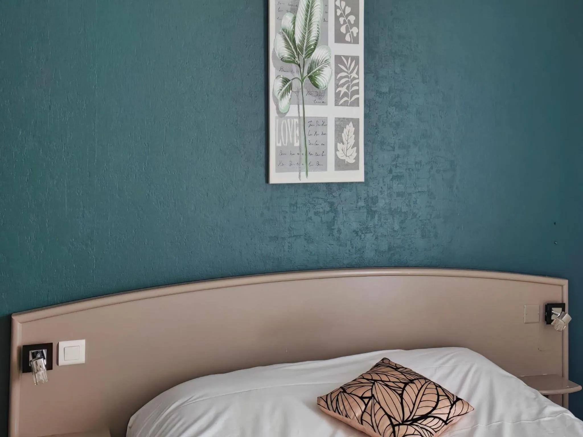 Bed in Hotel Beau Rivage