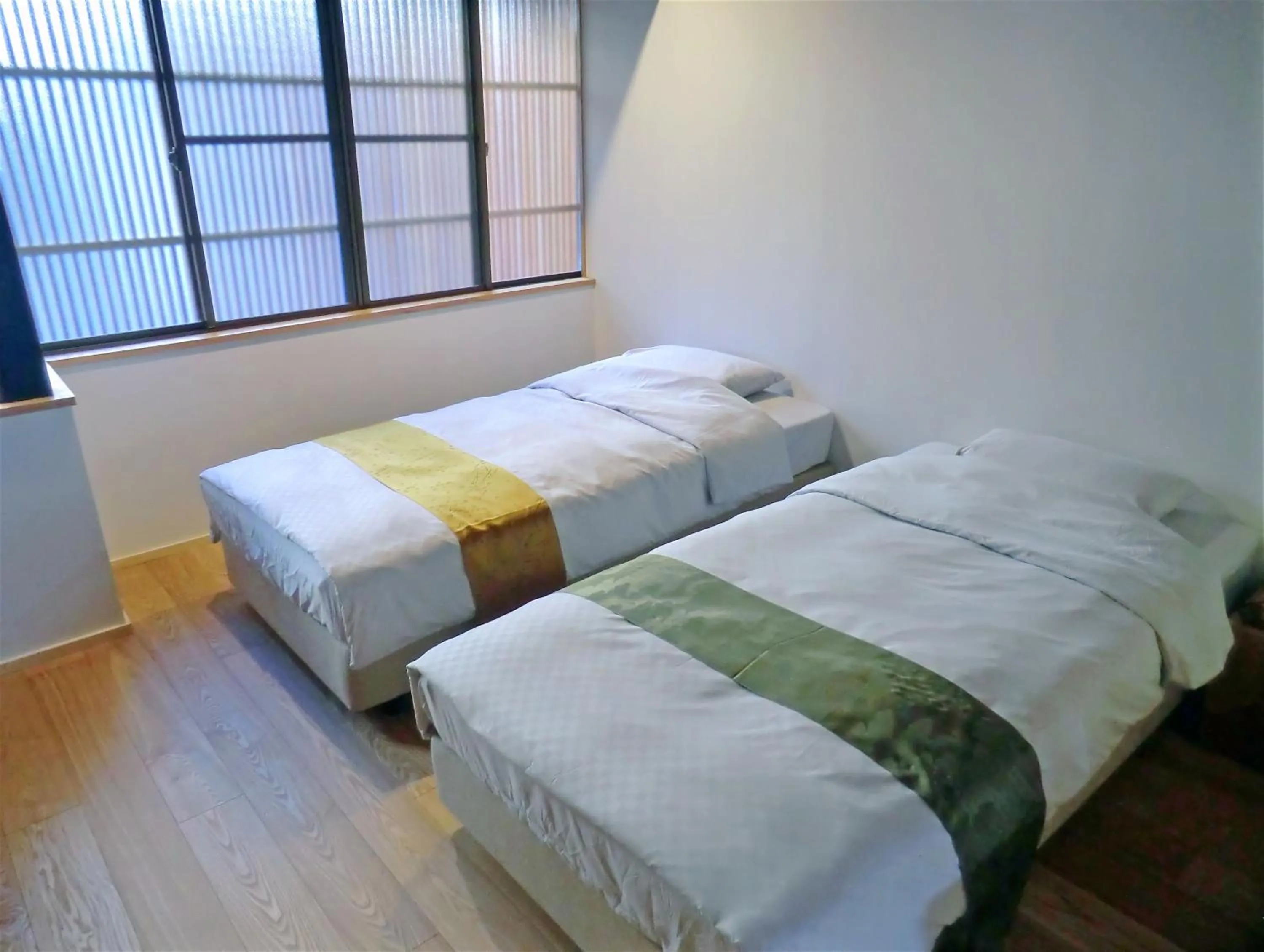 Bed in Machiya Hotel YANAGI