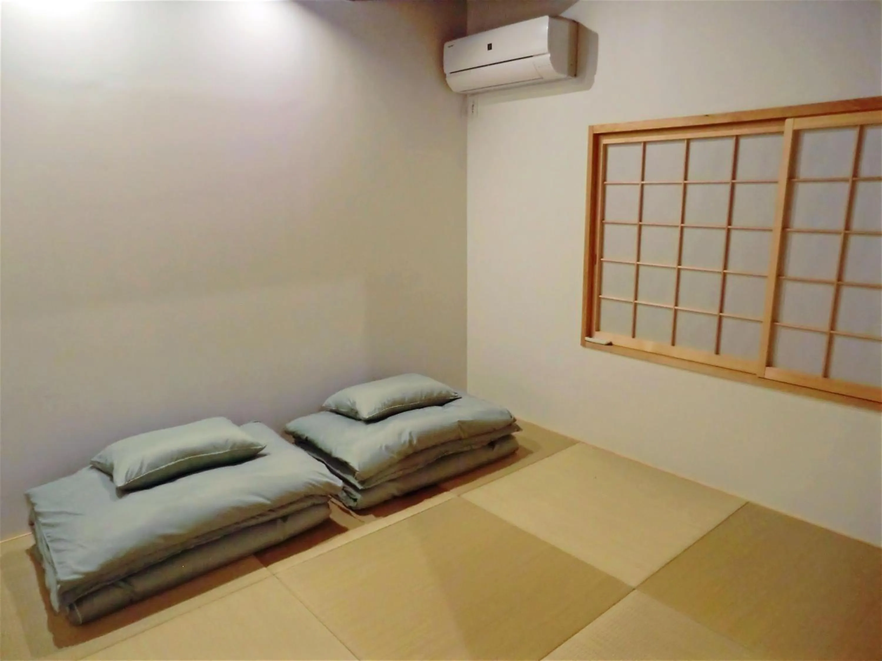 Bed in Machiya Hotel YANAGI