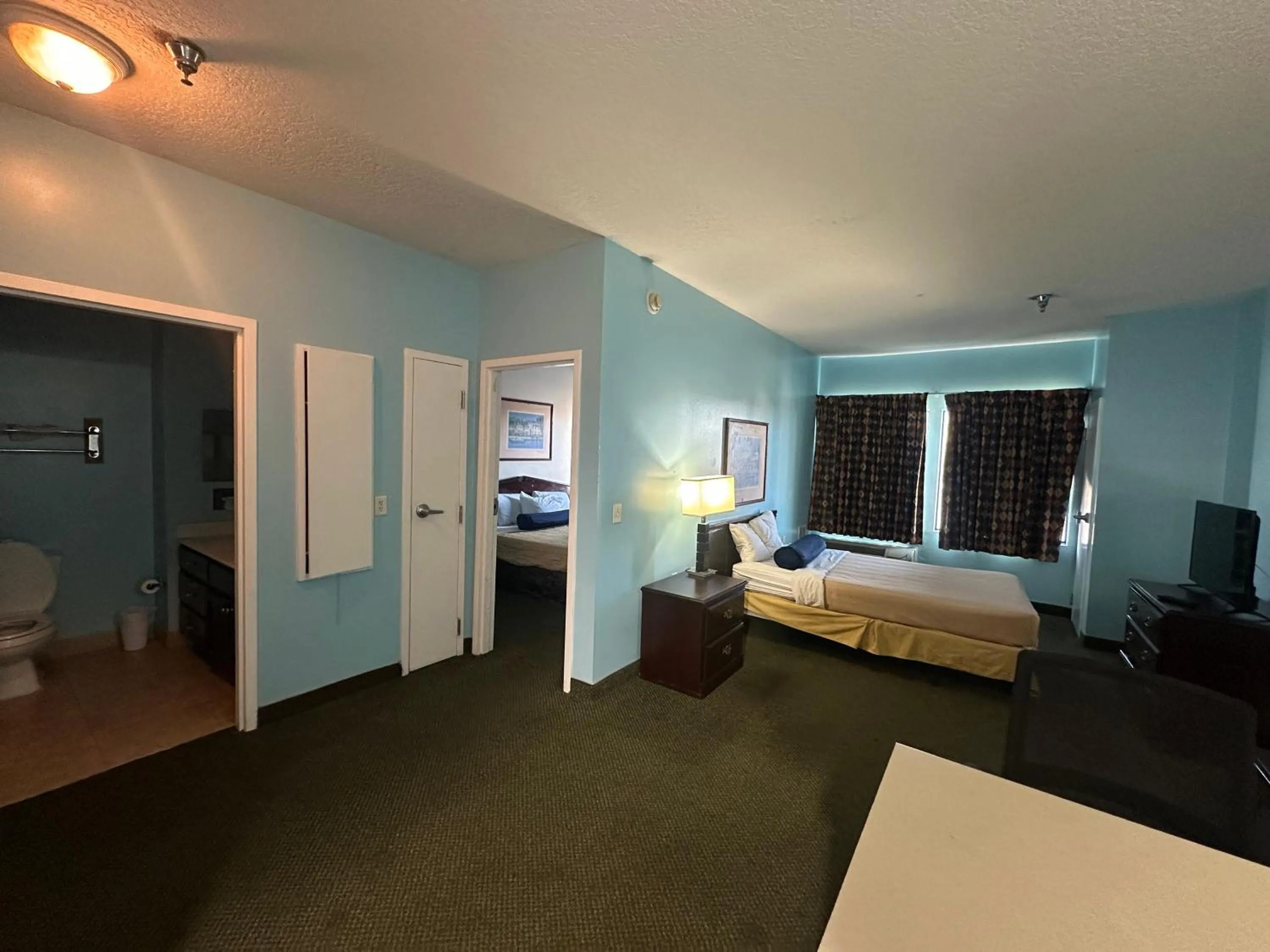 Bedroom in Guest Cottage & Suites By OYO Brunswick-Golden Isles