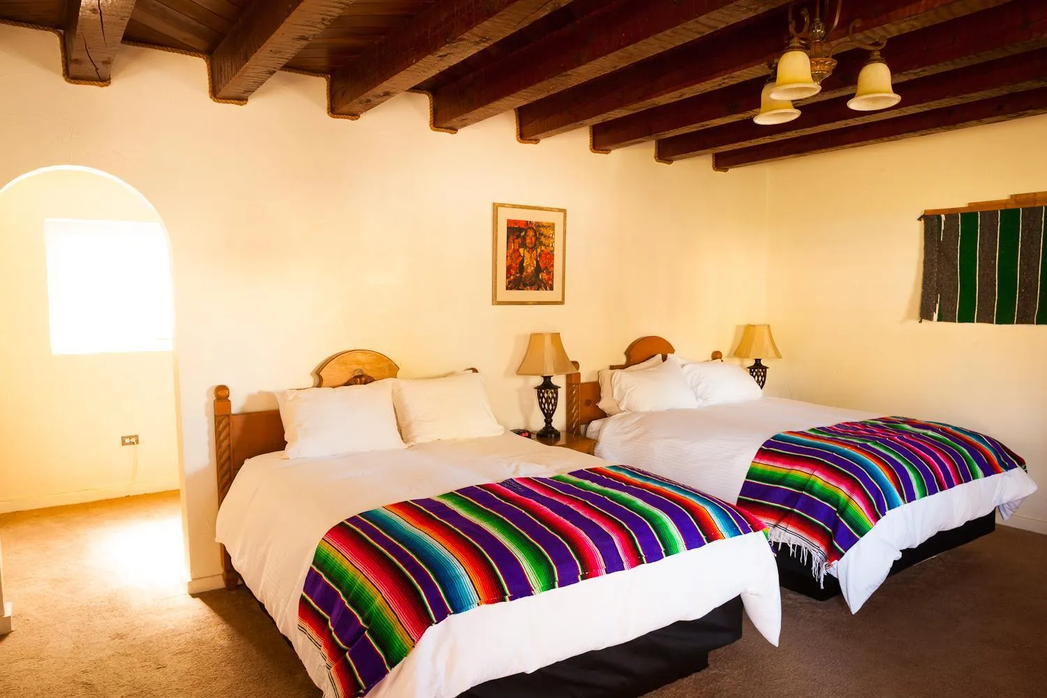 Bed in El Pueblo Lodge
