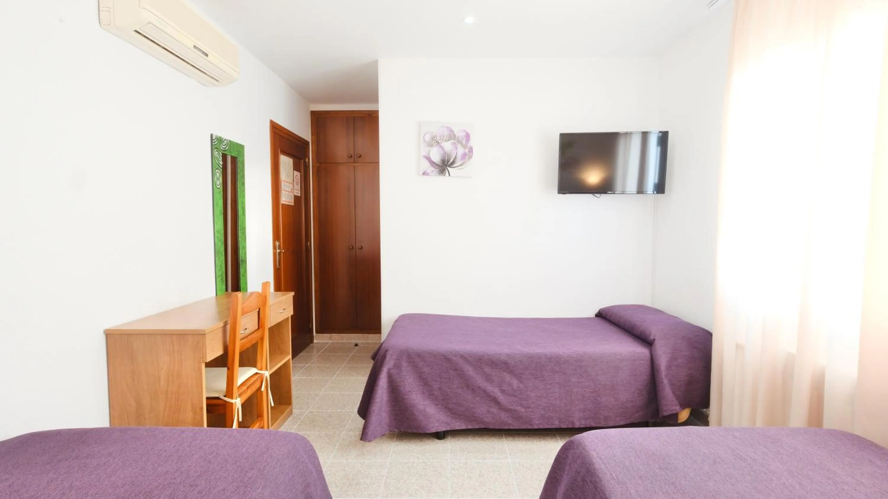 Bed in Hotel Paradís