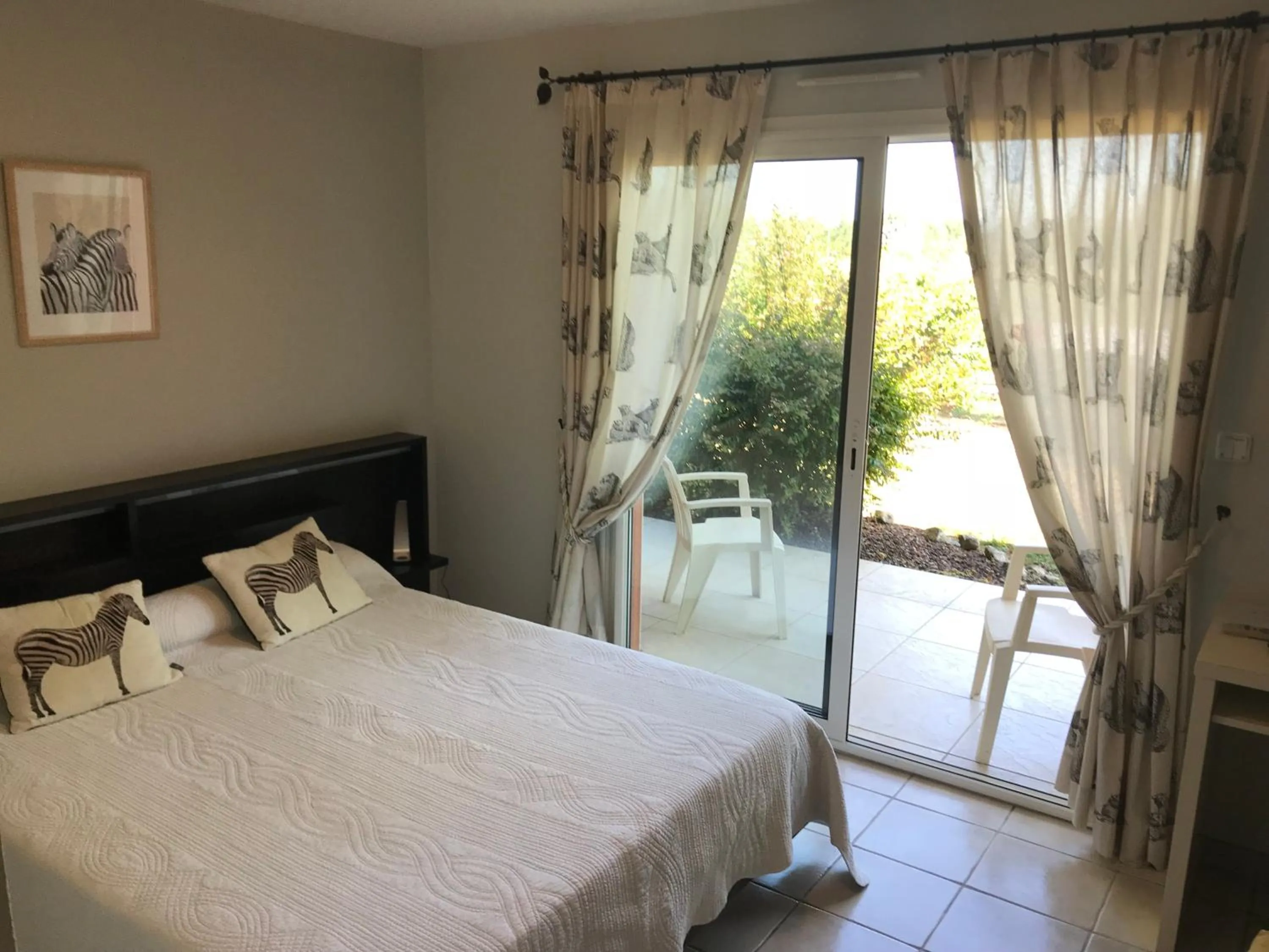 Bed in Chambres d'Hôtes La Coloniale