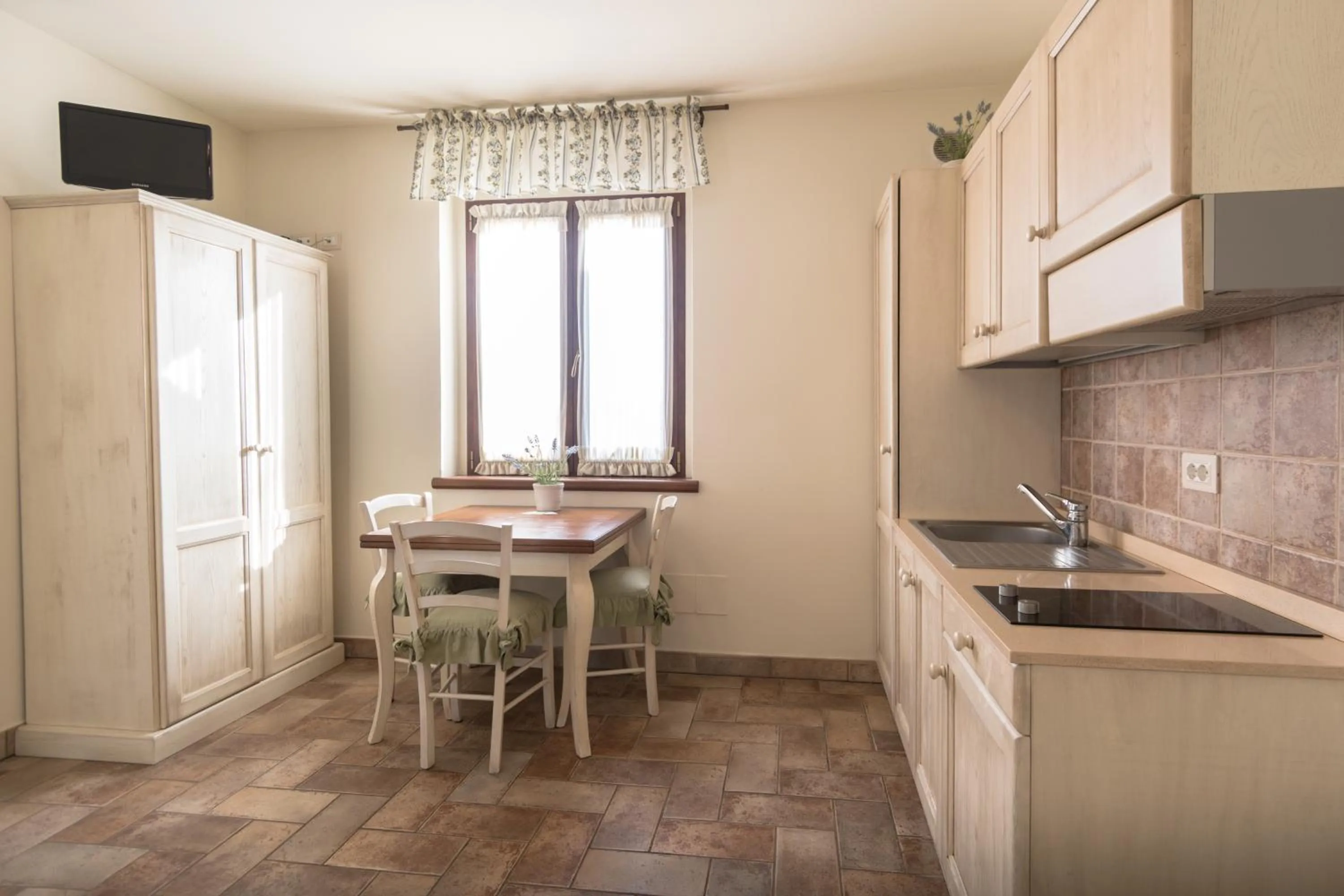 Kitchen or kitchenette in Rosa di Assisi