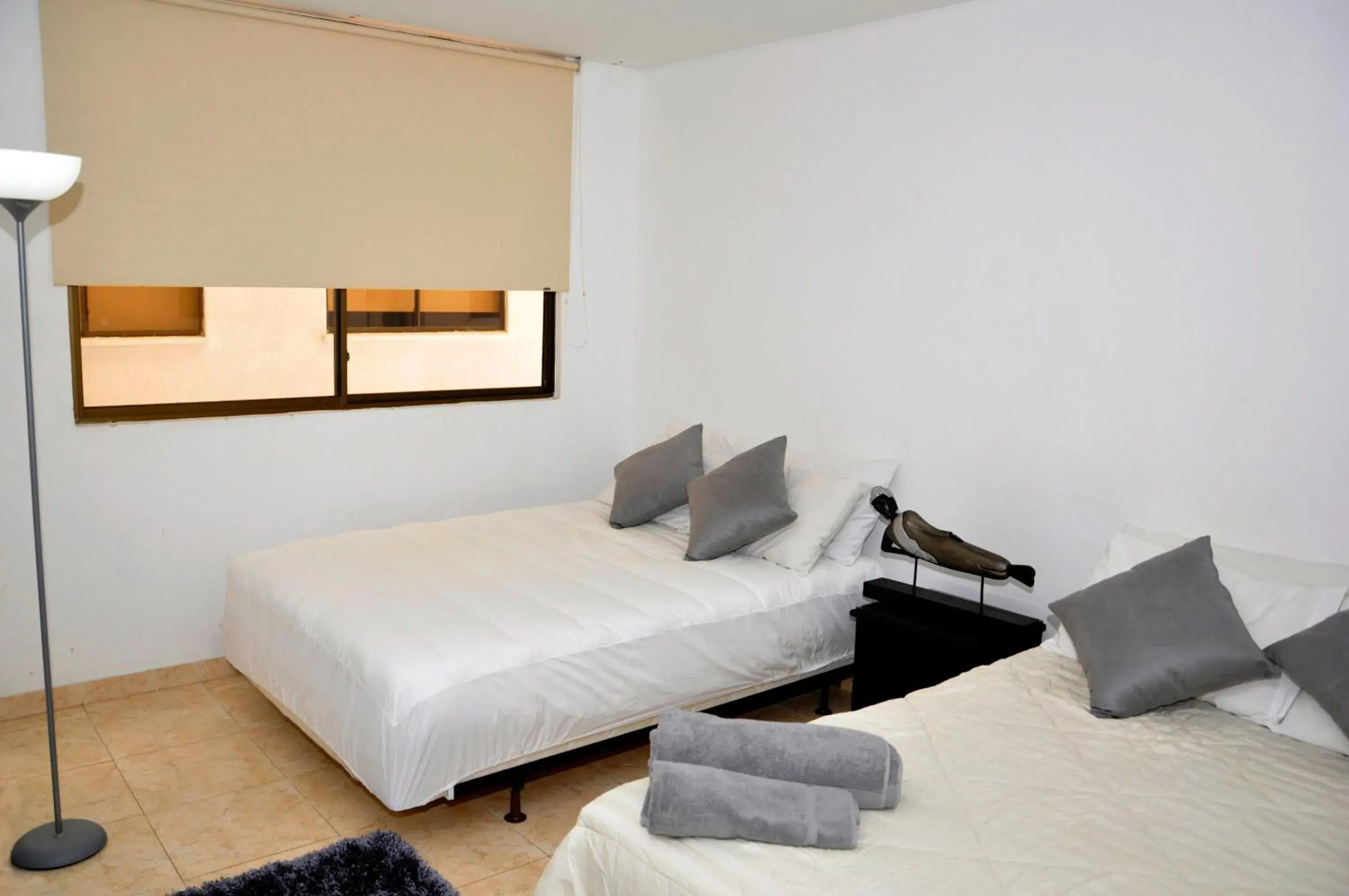 Bed in Hotel Axis Inn By GEH Suites Bed in Hotel Axis Inn By GEH Suites