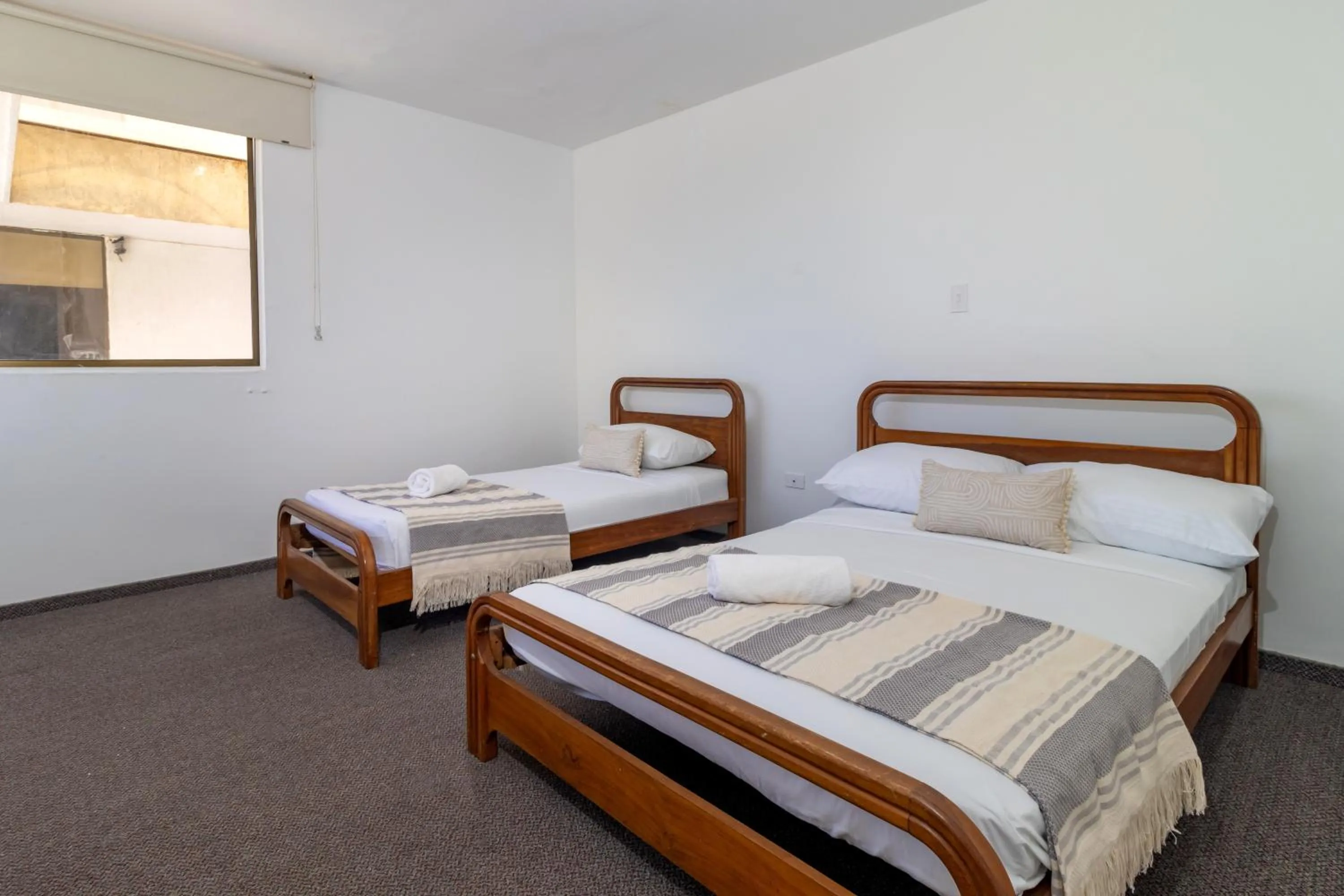 Bed in Hotel Axis Inn By GEH Suites