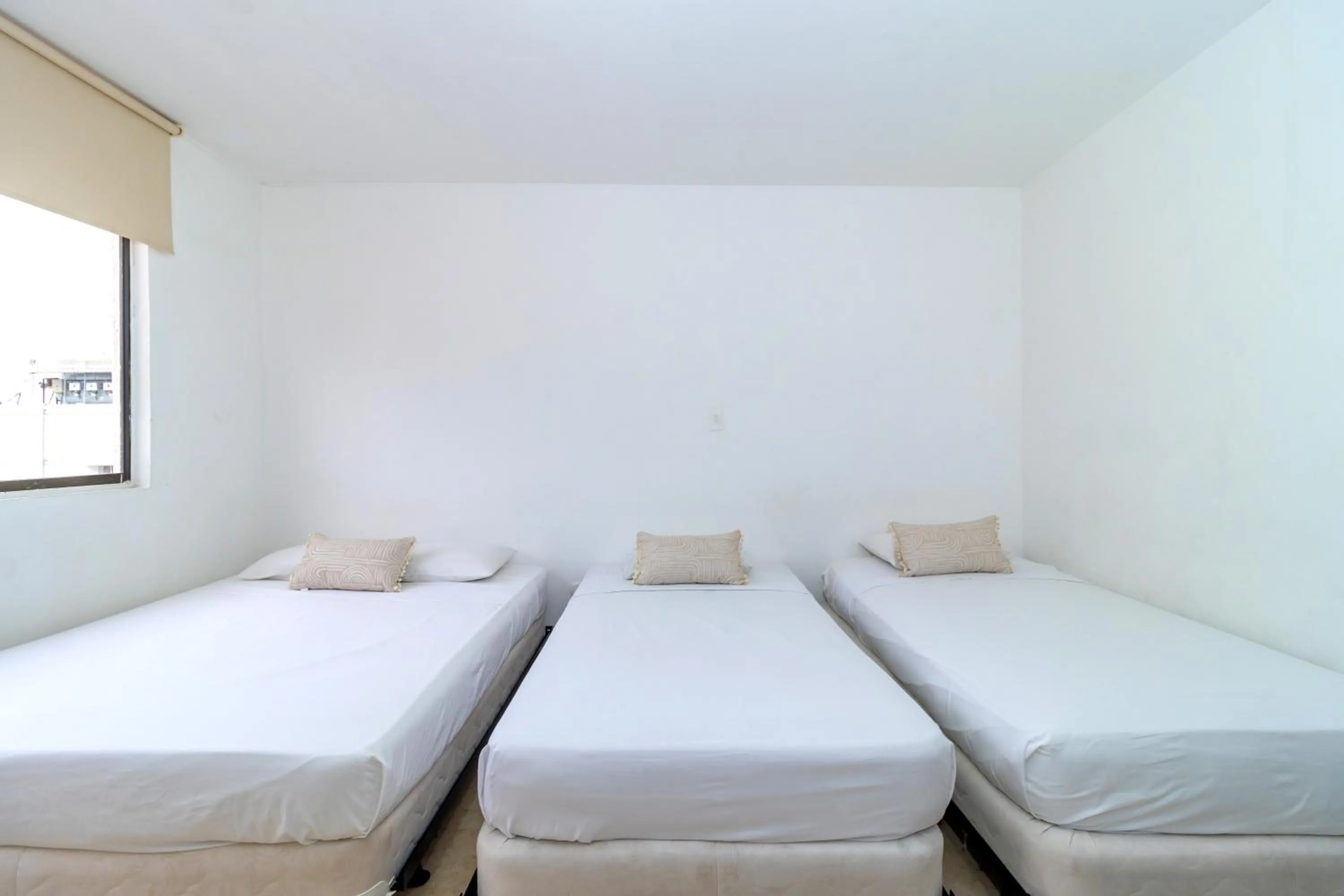 Bed in Hotel Axis Inn By GEH Suites