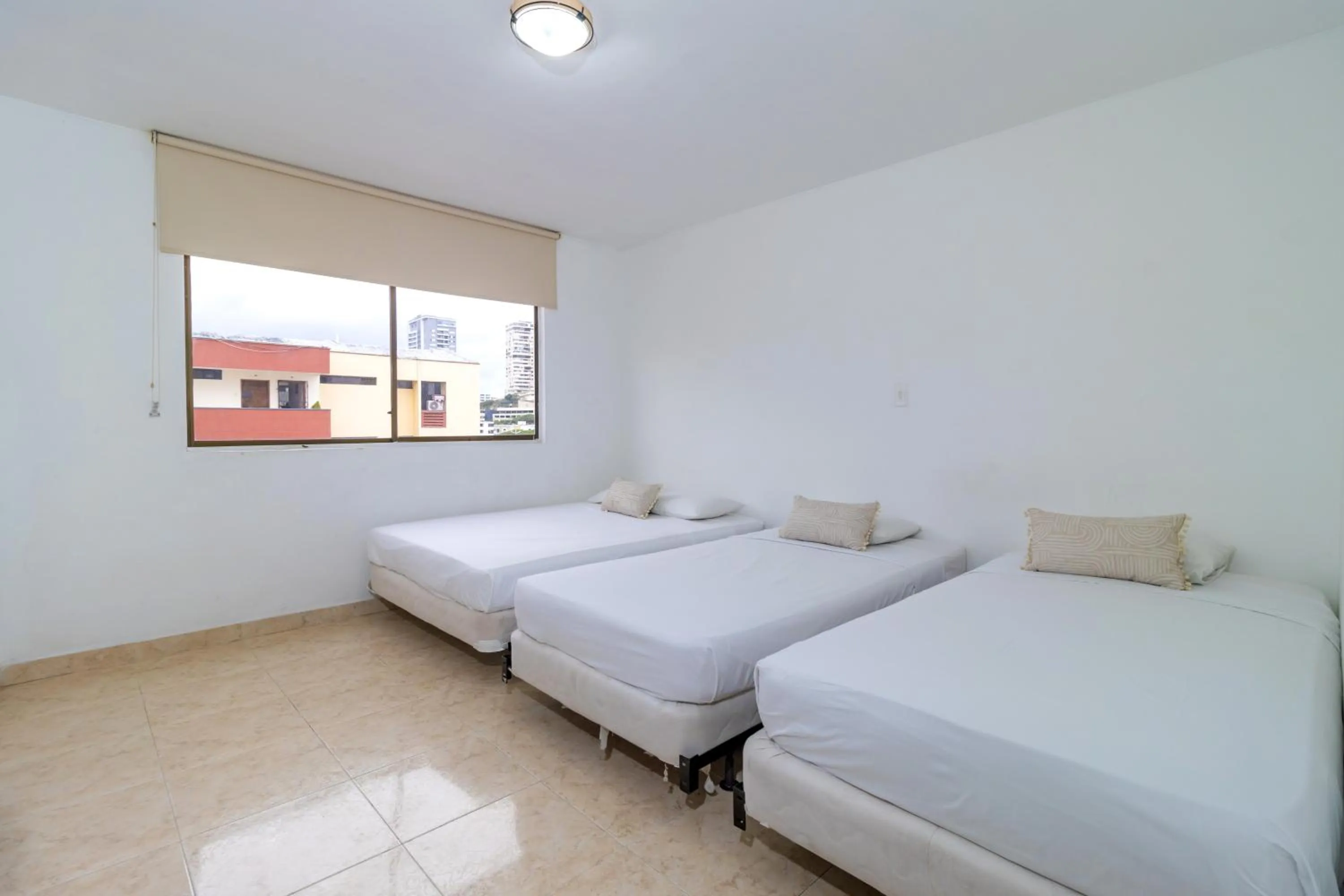 Bed in Hotel Axis Inn By GEH Suites