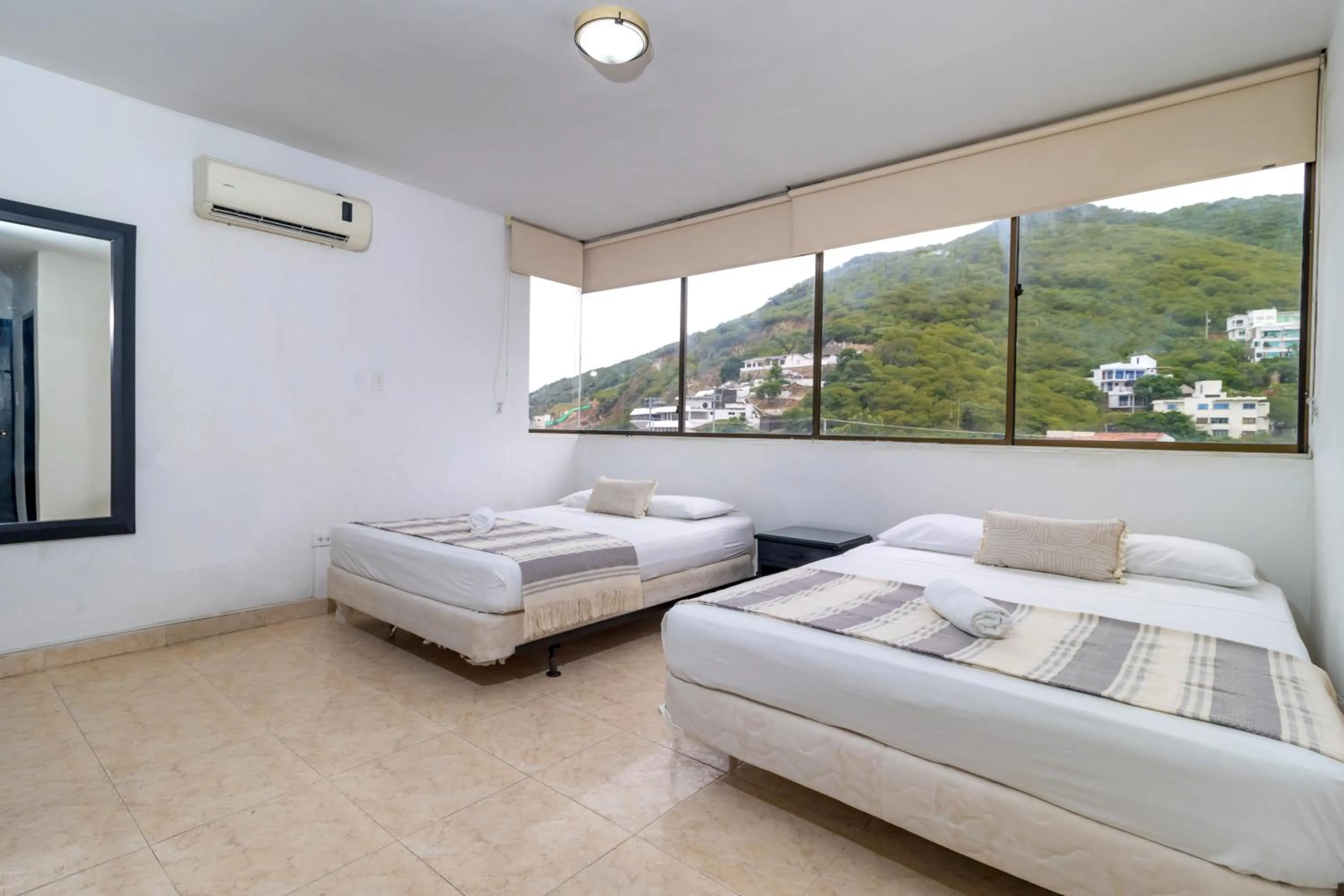 Bed in Hotel Axis Inn By GEH Suites