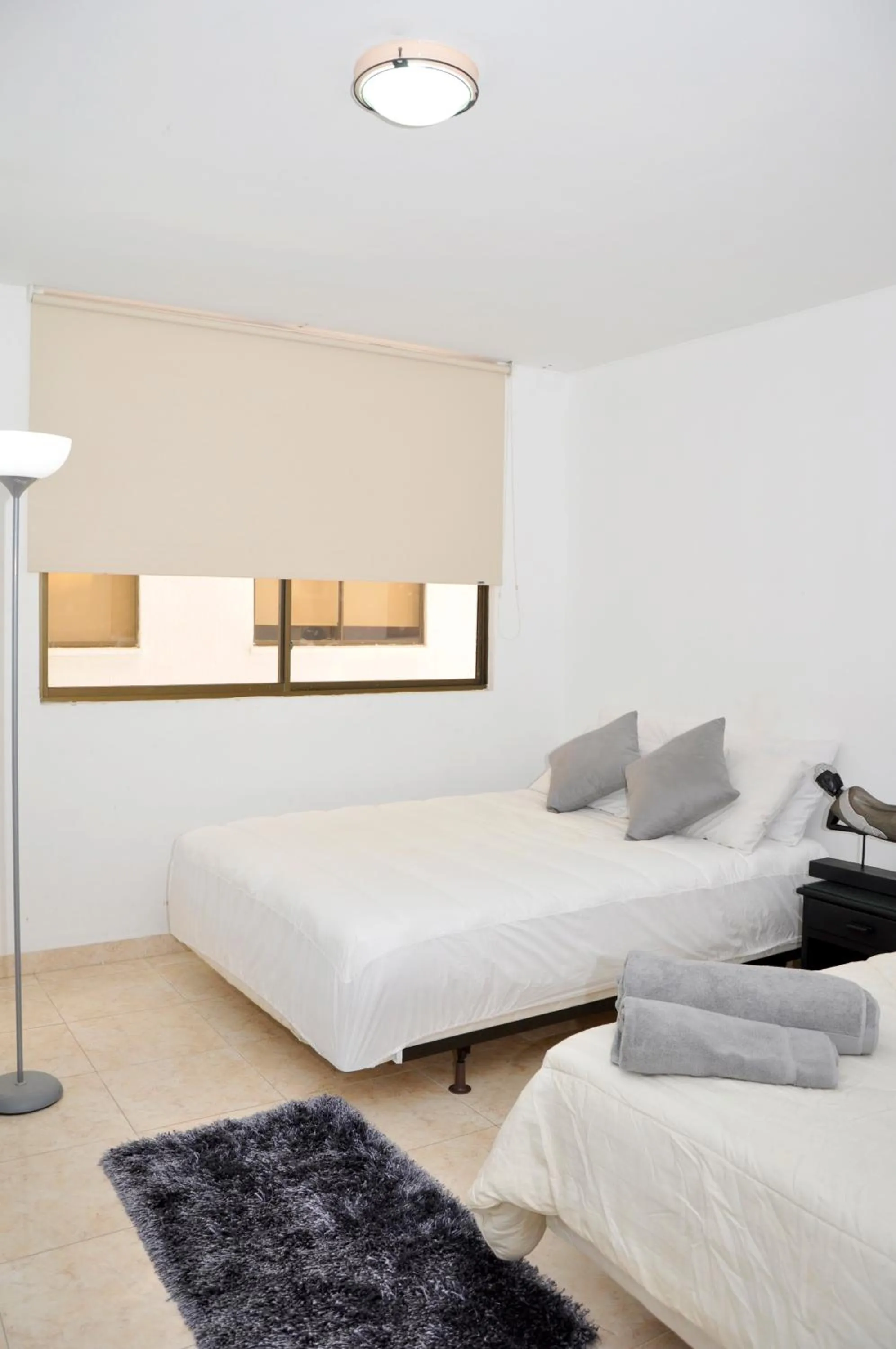 Bed in Hotel Axis Inn By GEH Suites