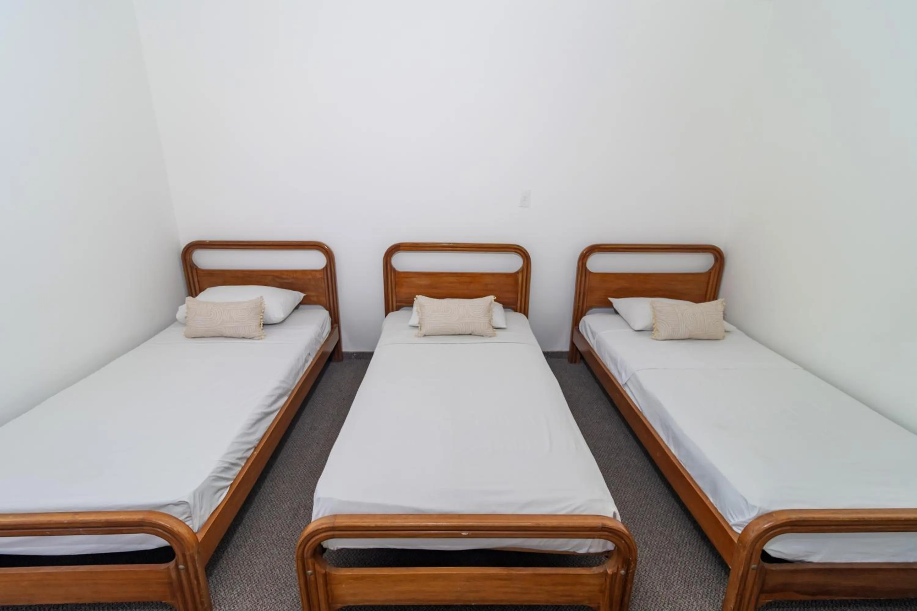 Bed in Hotel Axis Inn By GEH Suites