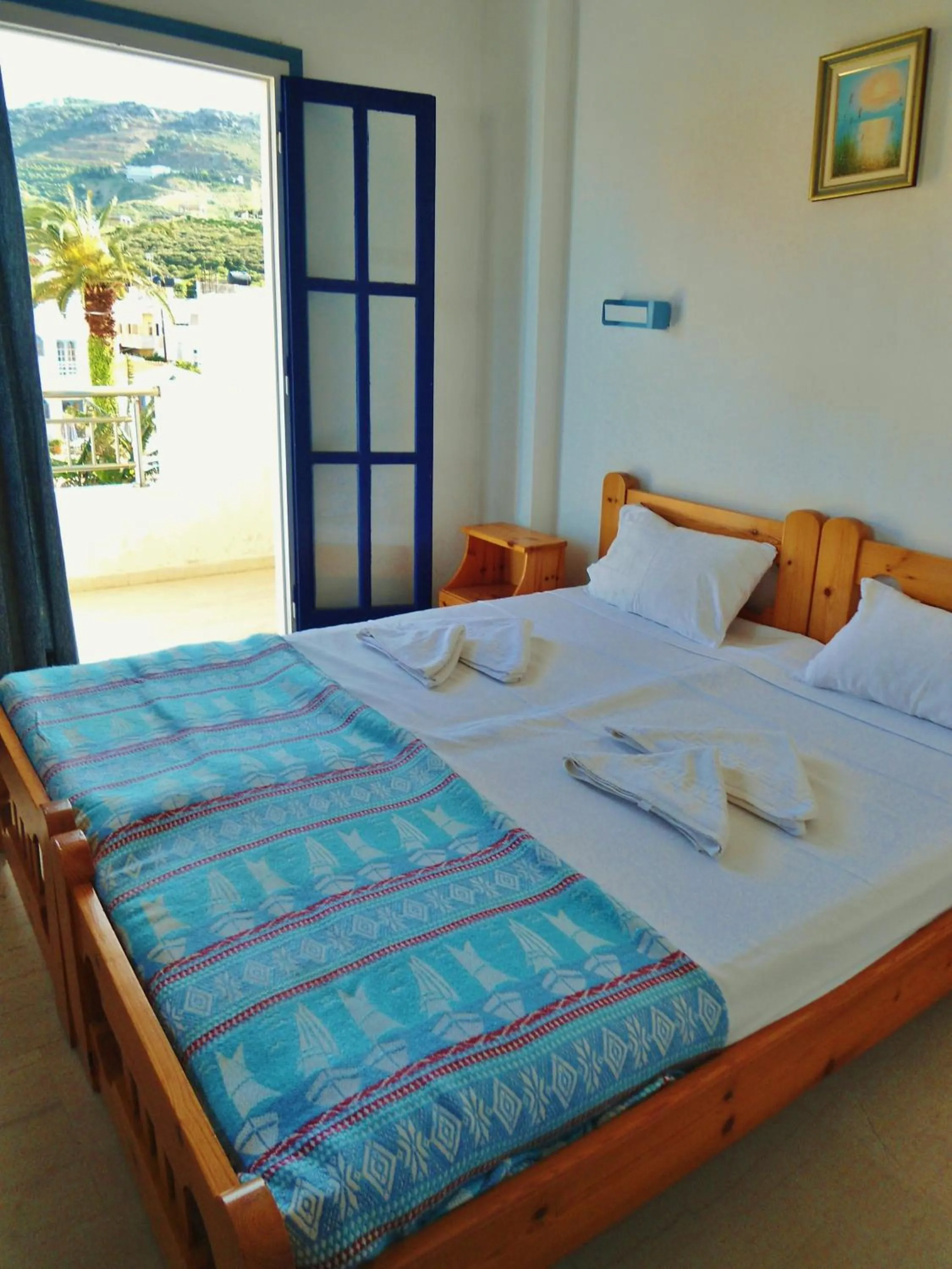 Bed in Apollonia Apartments