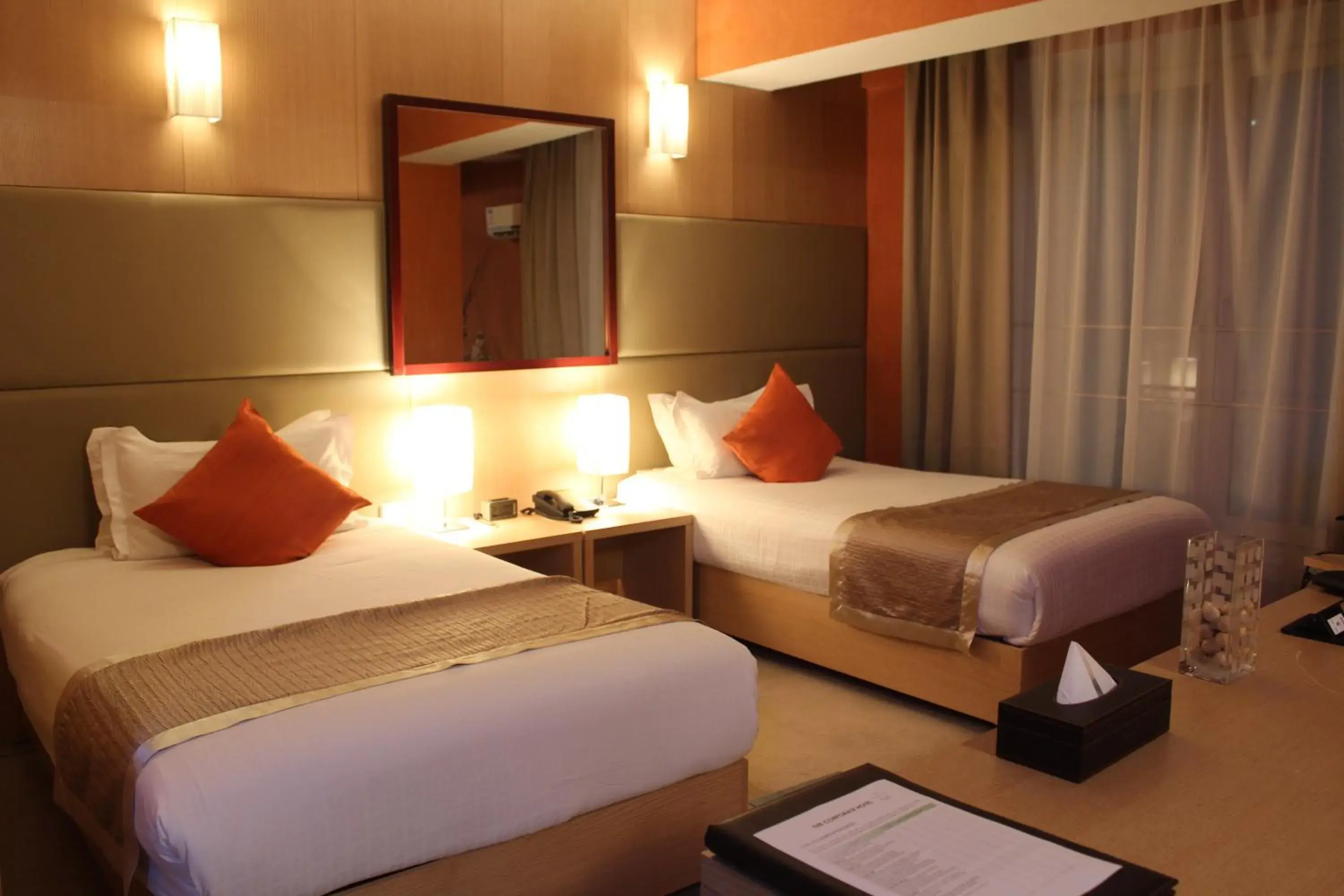 Bed in The Corporate Hotel Bed in The Corporate Hotel