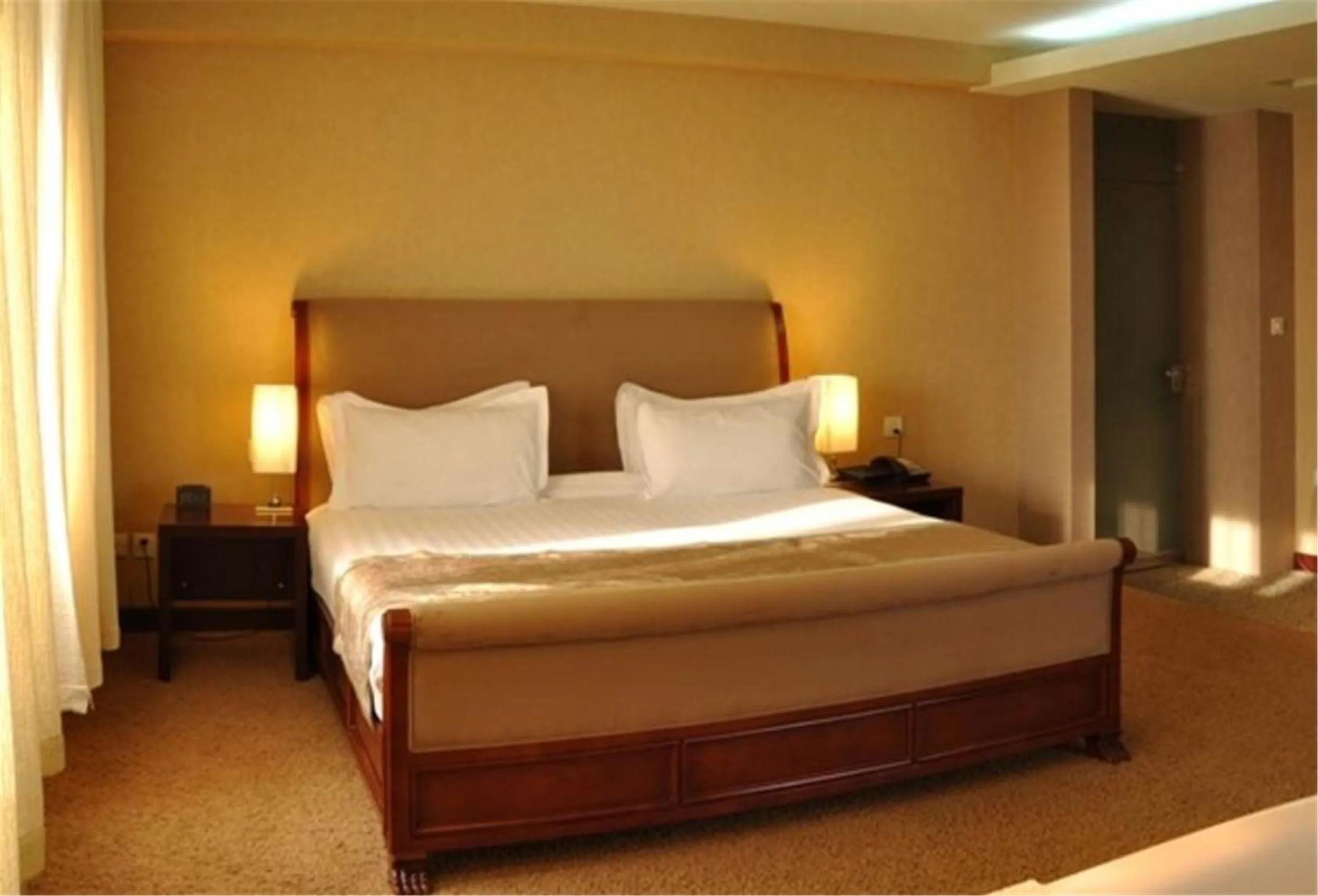 Bed in The Corporate Hotel