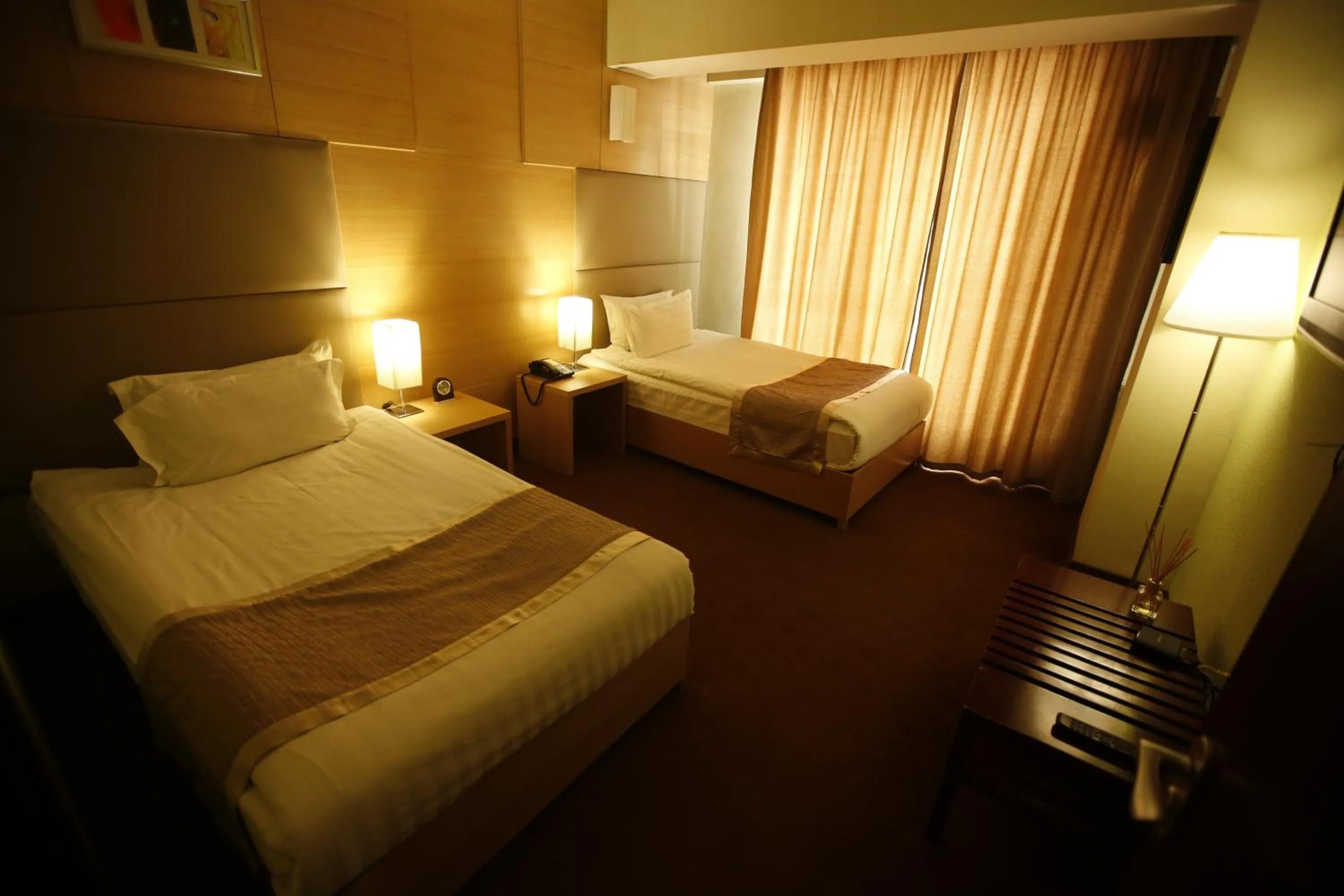 Bed in The Corporate Hotel