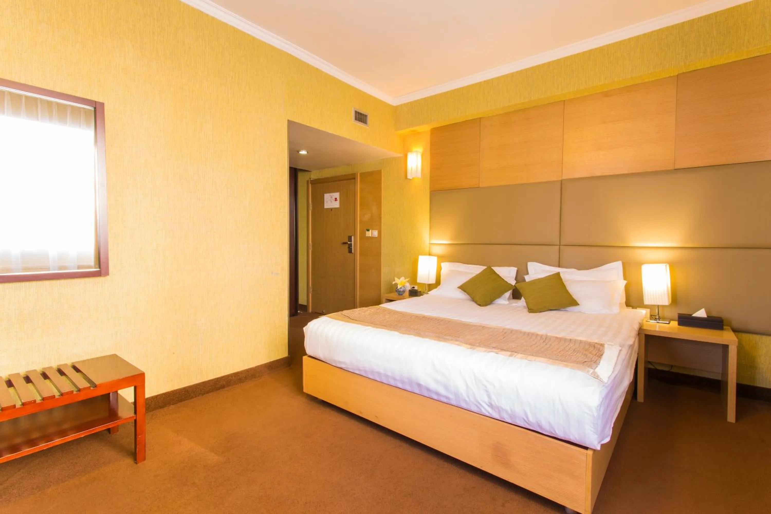 Bed in The Corporate Hotel