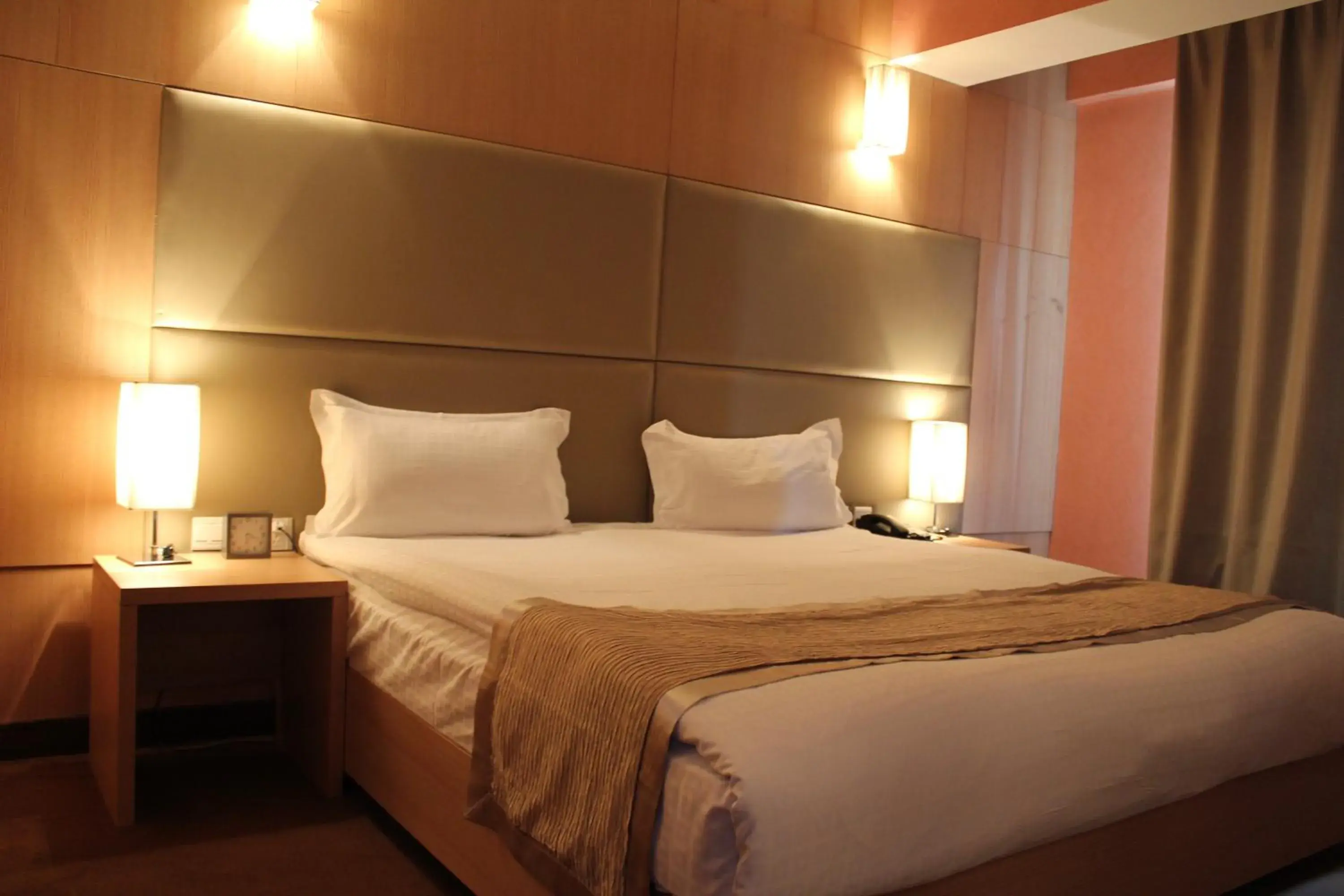 Bed in The Corporate Hotel Bed in The Corporate Hotel