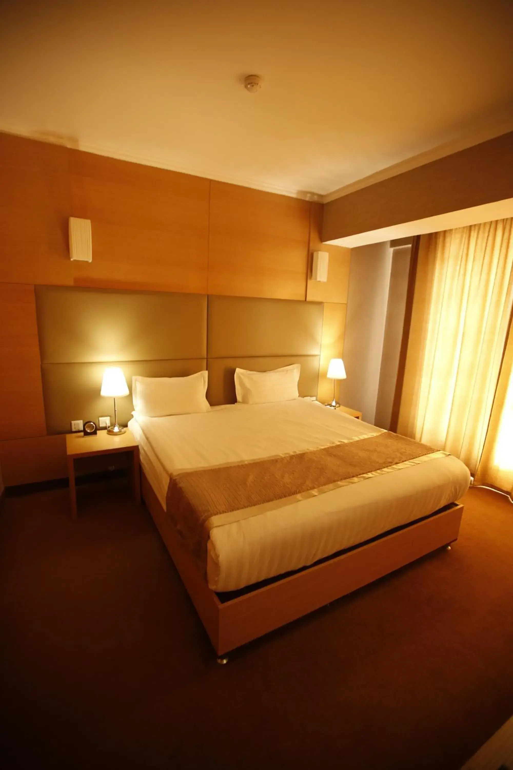 Bed in The Corporate Hotel Bed in The Corporate Hotel