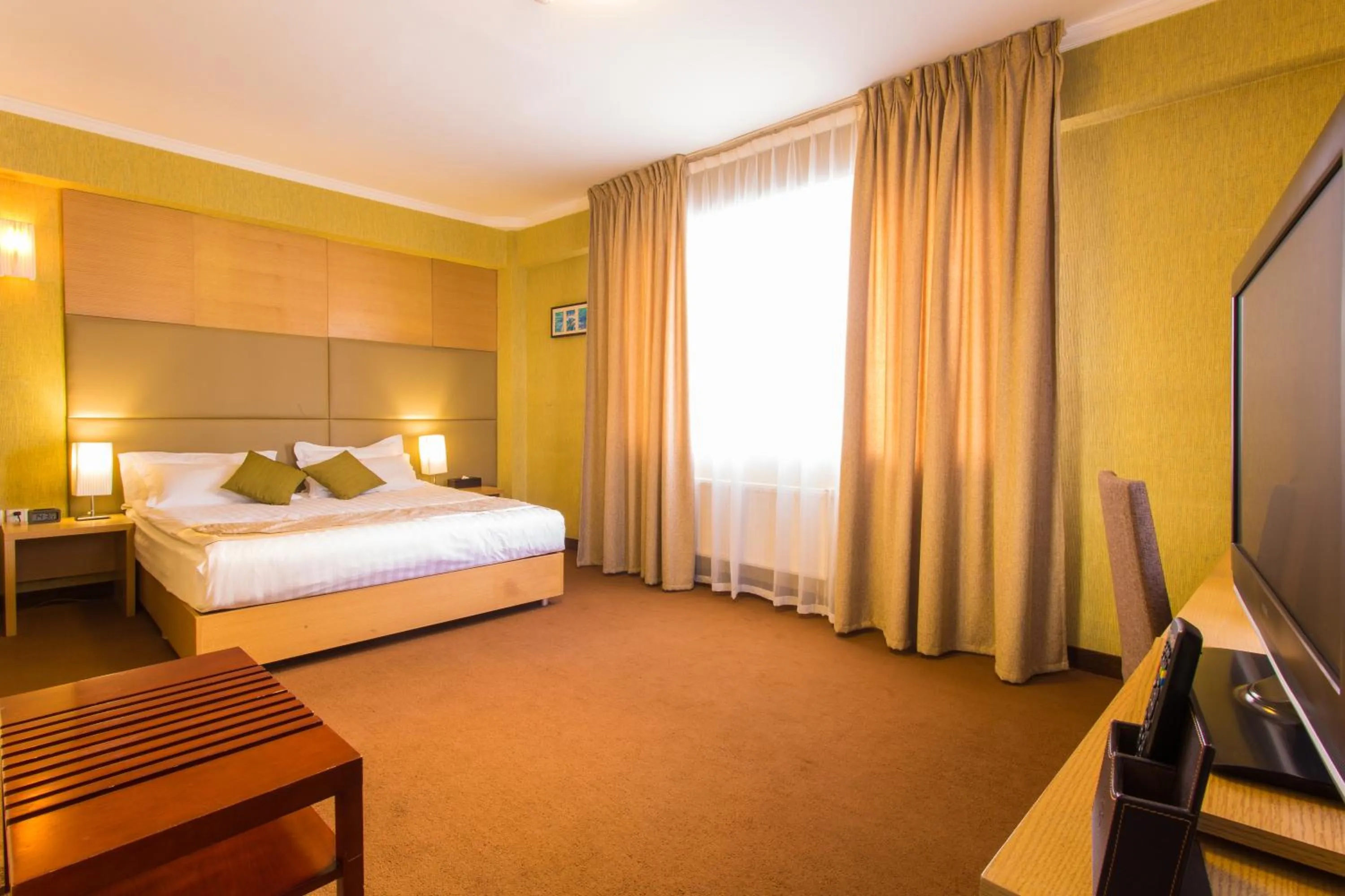 Bed in The Corporate Hotel