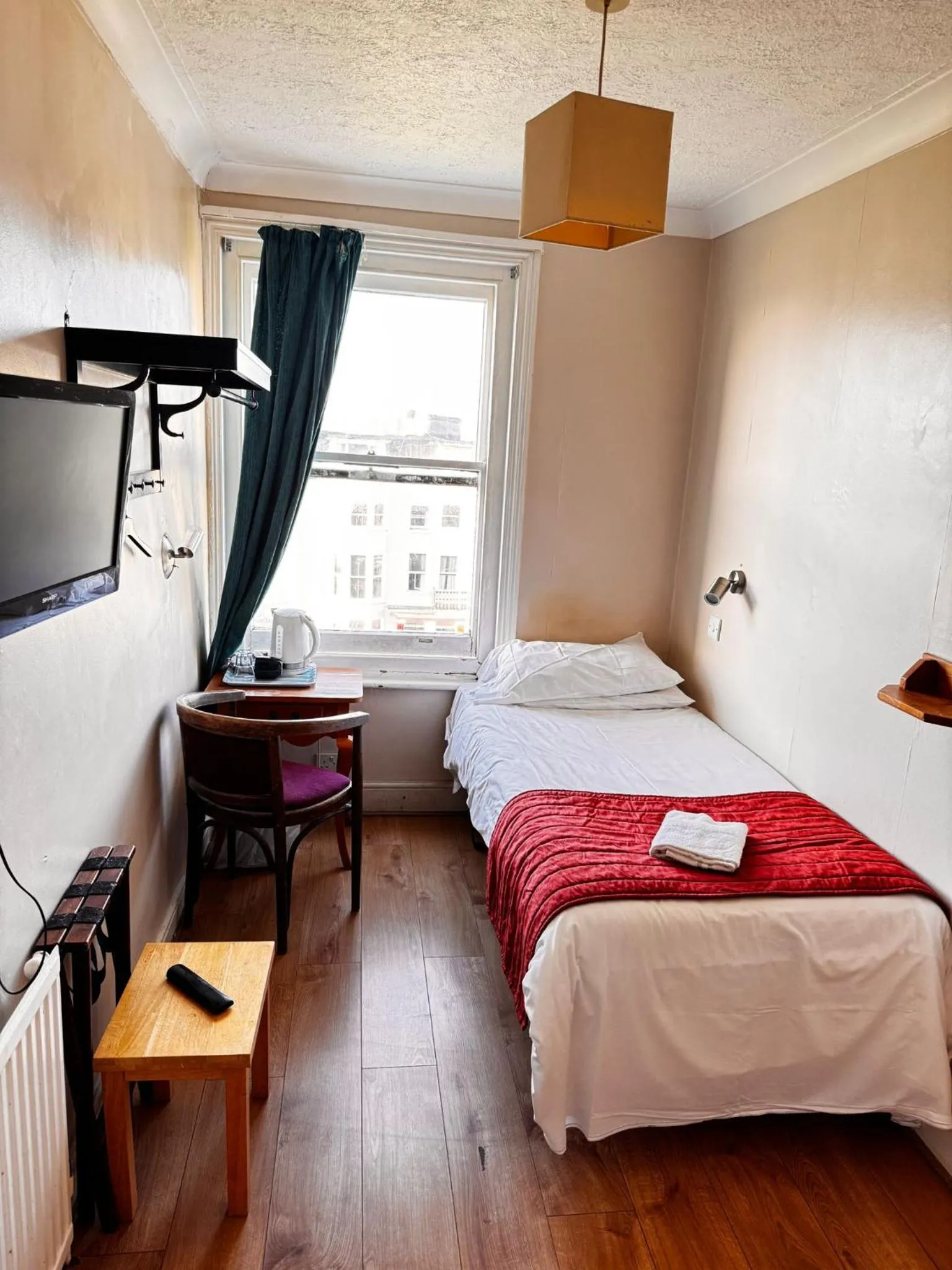 Bed in Ambassador Hotel