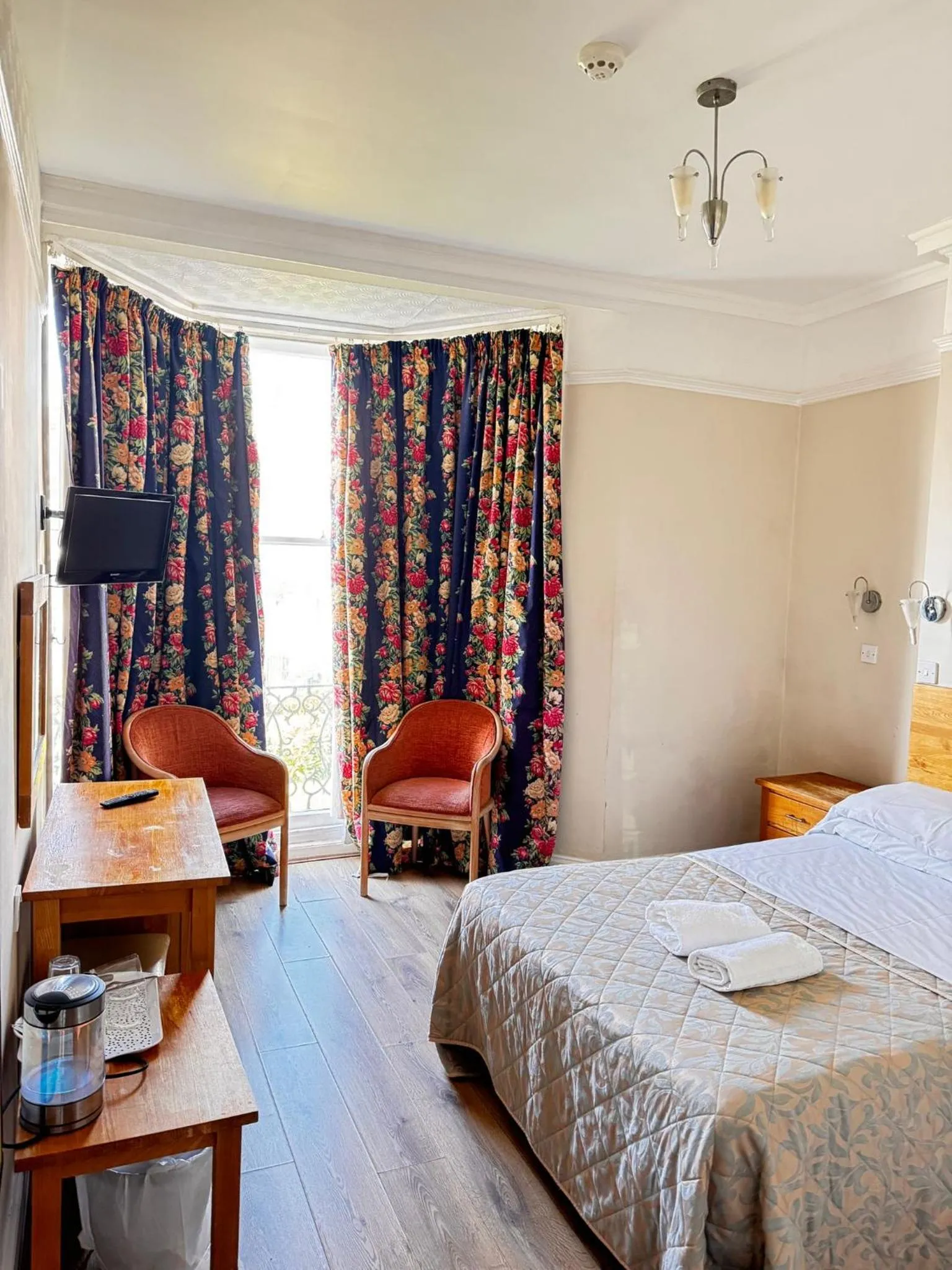 Bed in Ambassador Hotel