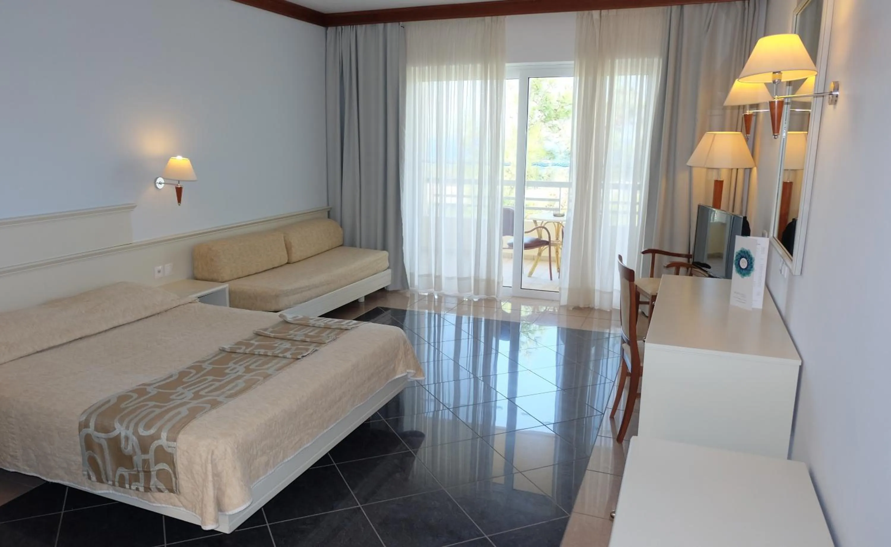 Bed in Kipriotis Maris Suites