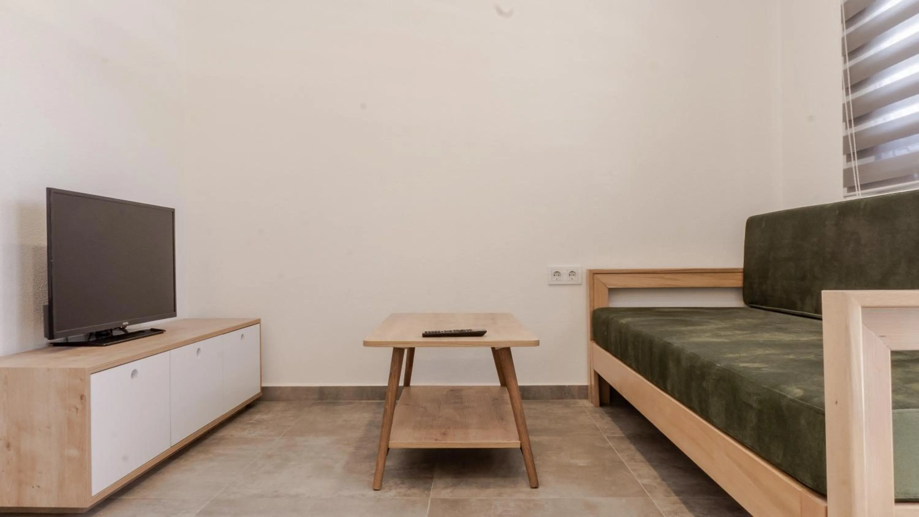 Living room, Bed in Daphnis Hotel