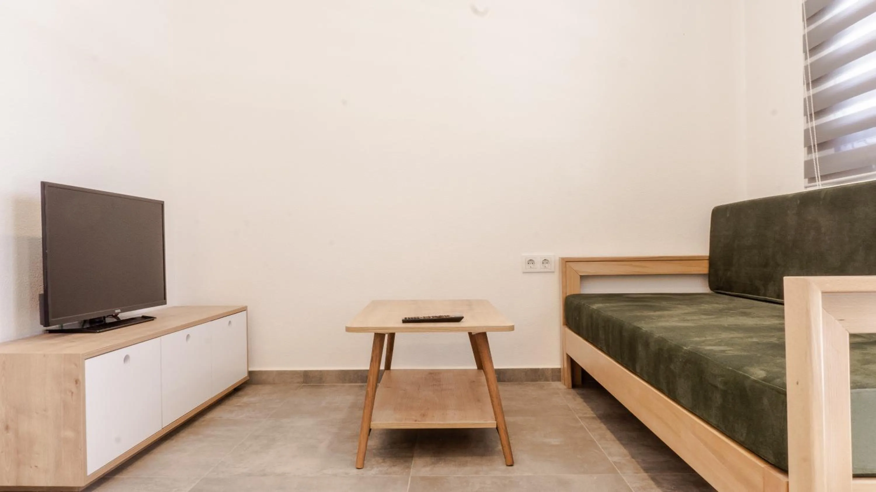 Living room, Bed in Daphnis Hotel