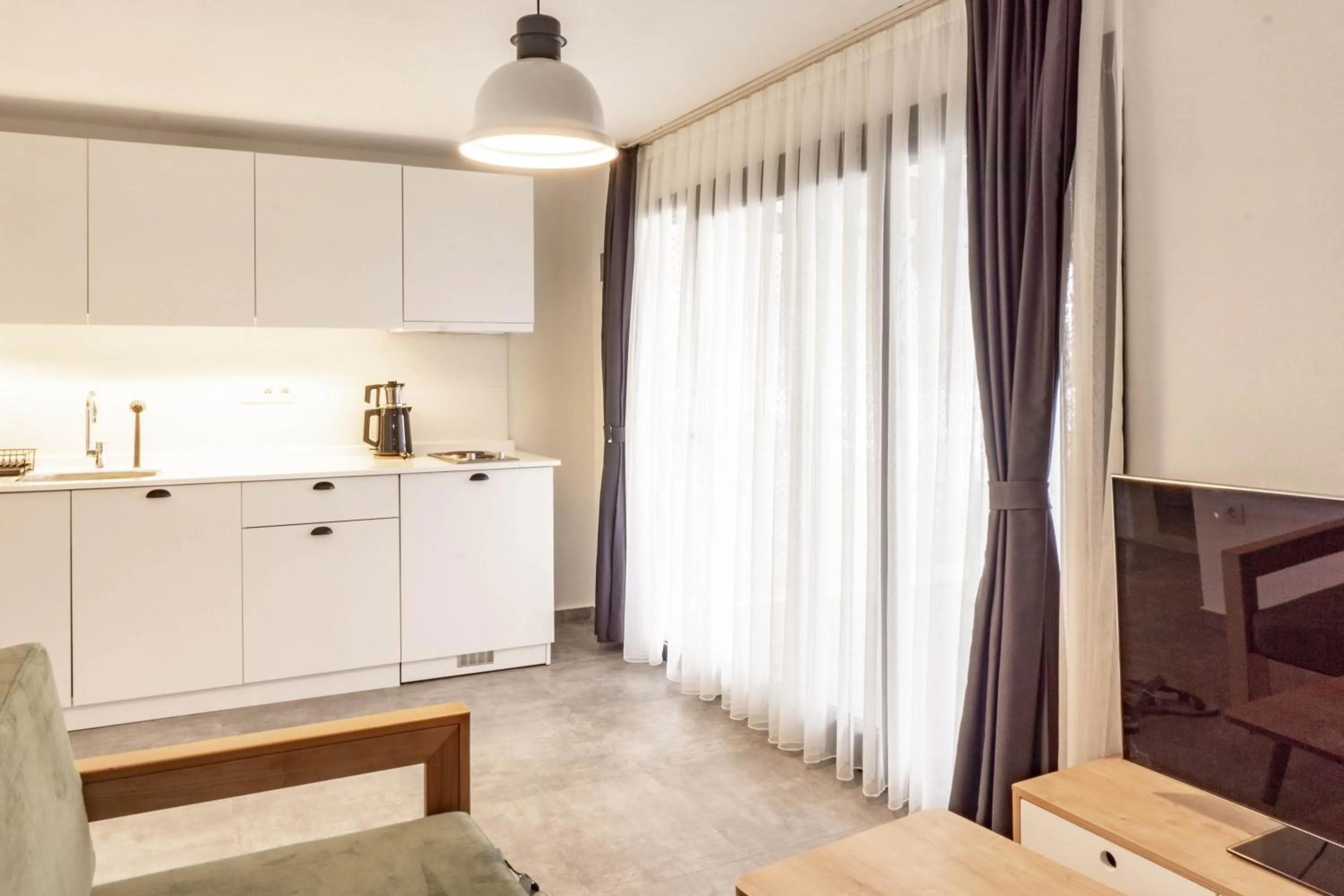 Kitchen or kitchenette in Daphnis Hotel
