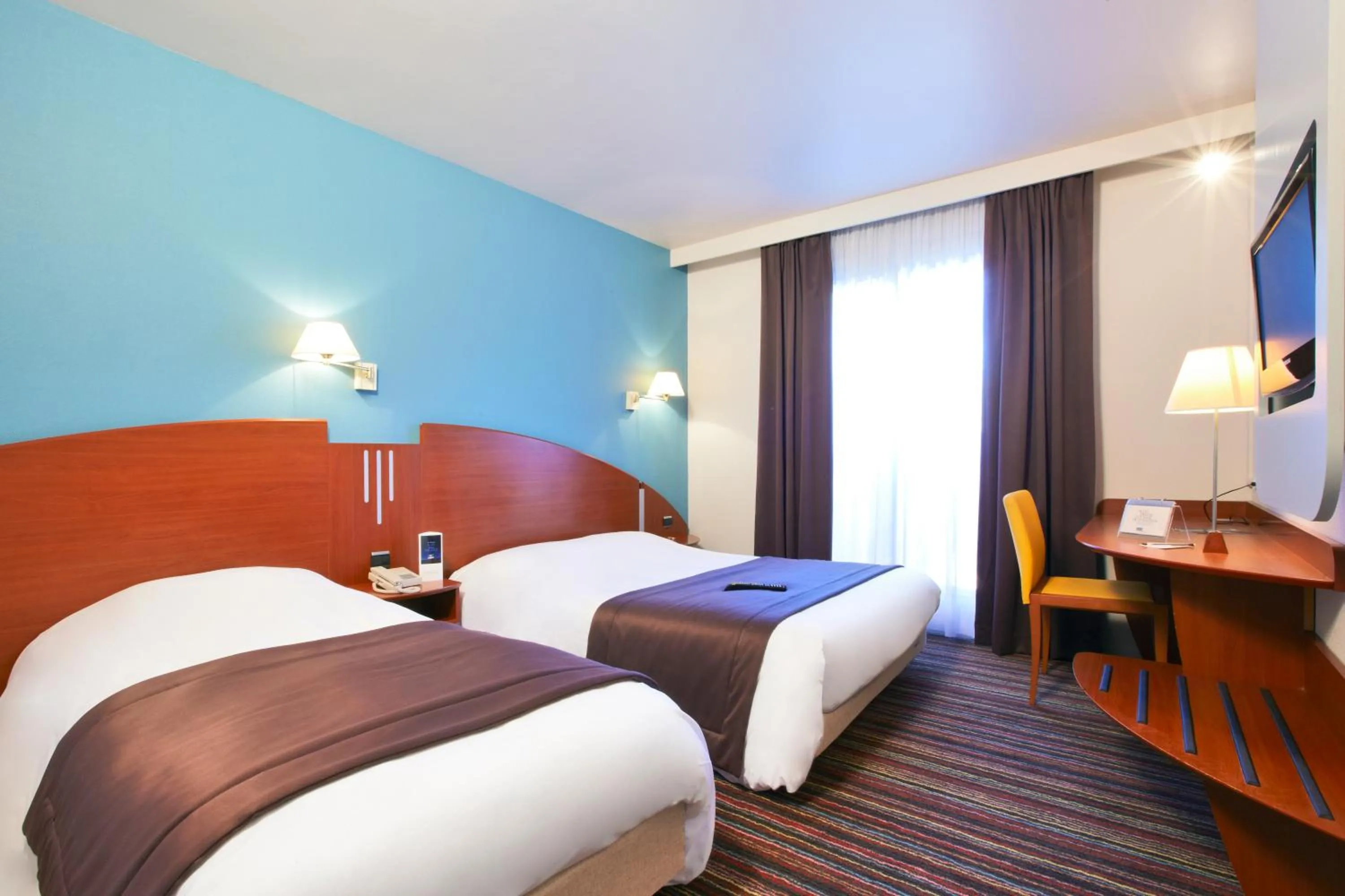 Bedroom in Kyriad Bourg En Bresse